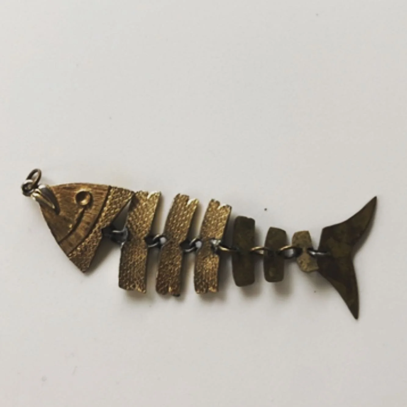 My dad could do anything we asked of him with our jewelry. In college this was my favorite piece but I lost the bottom at a bar. He recreated it for me. And when I reminded him about 20 years later he whipped out the spare pieces in under a minute.