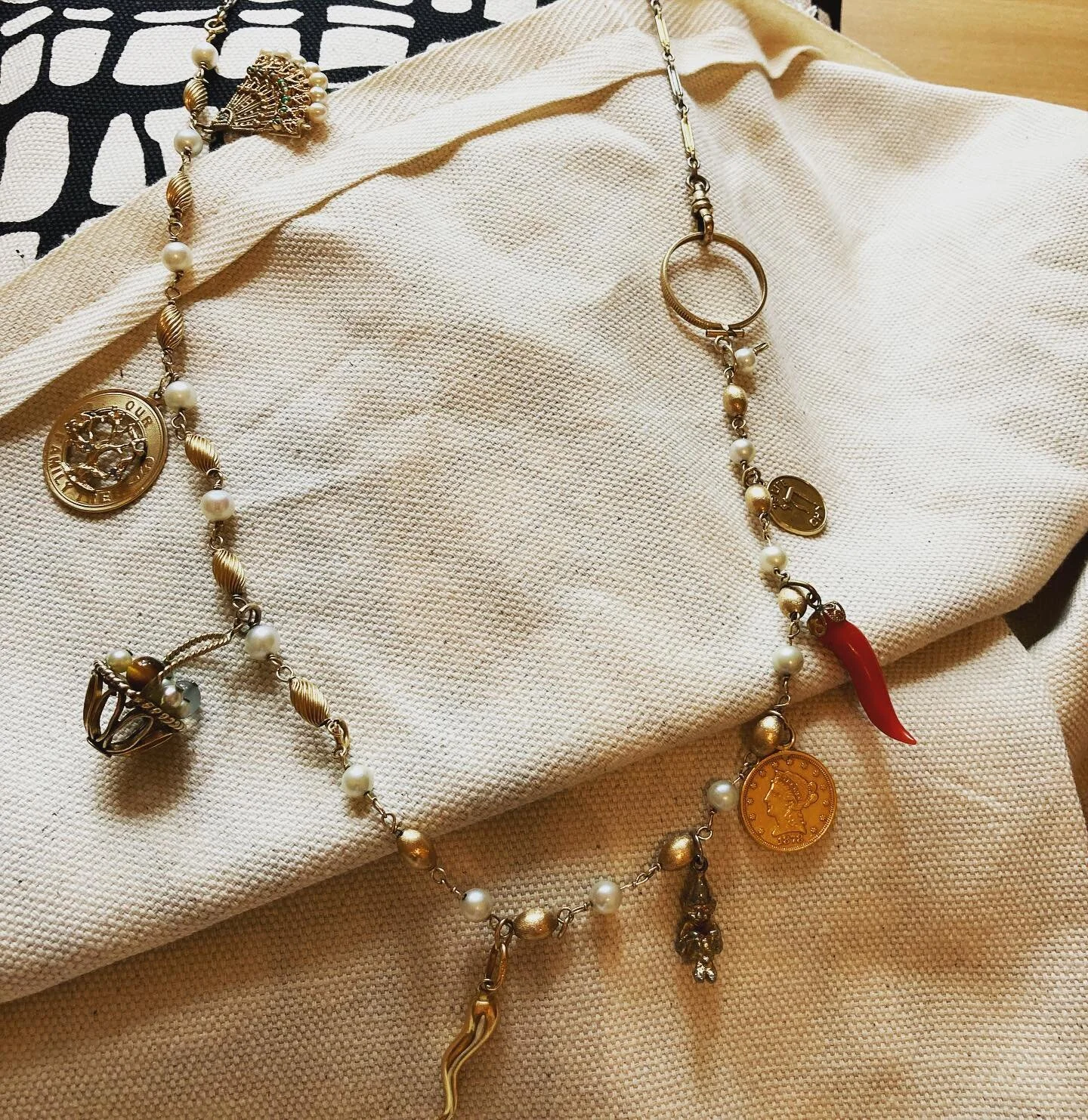 My dad had dozens of charm bracelets in that big jewelery box. Timelines marked with celebratory moments or coming of age milestones. I think this was Karen&rsquo;s based on some of the engravings on the gold.  Or maybe her mom just transferred some 