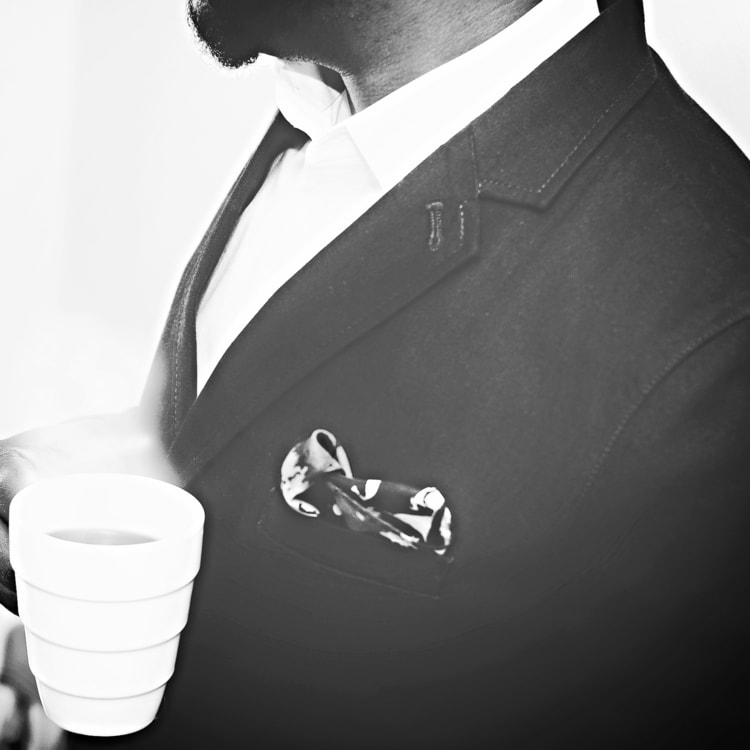 man-suit-white-coffee-cup-min.jpeg