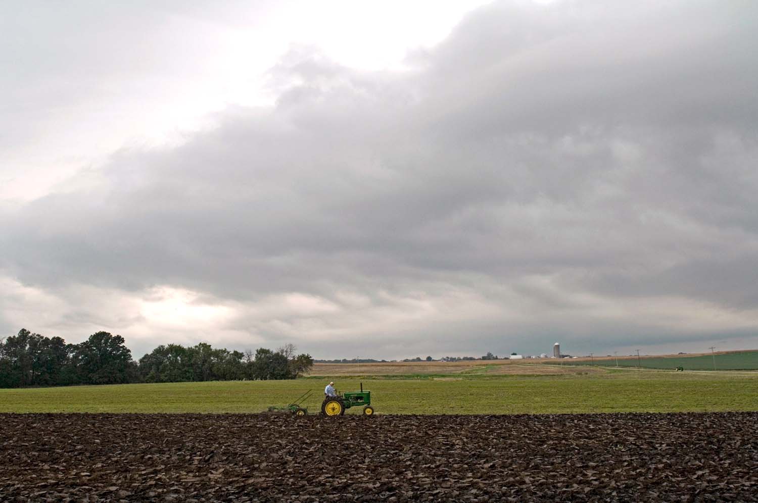  Plow Day, a local event where farmers let neighbors plow their fields with old farm equipment.  Denver, Illinois. September, 2010. 