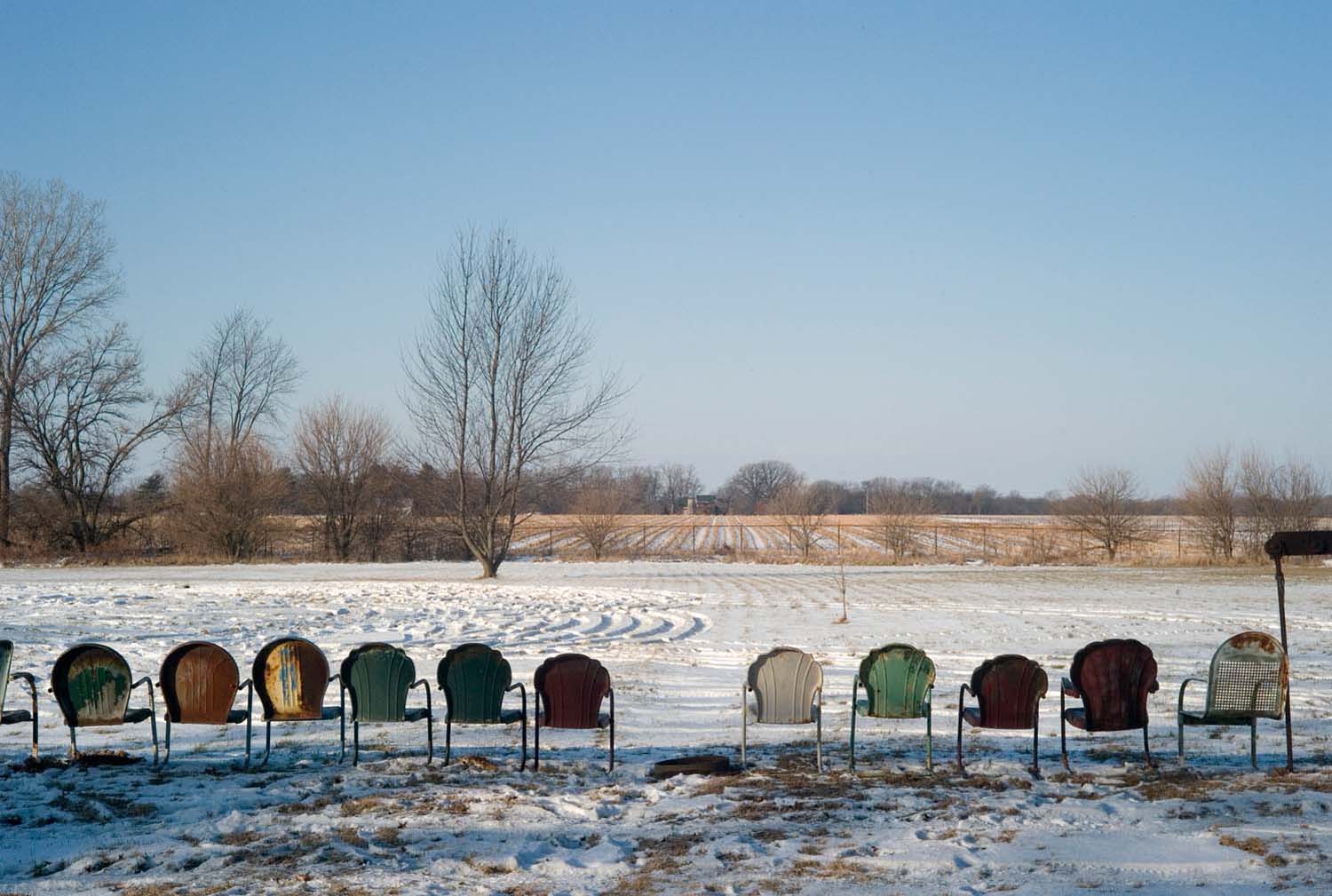  Metal lawn-chairs lined up in a row for sale at auction. Monmouth, IL. Dec. 2008 