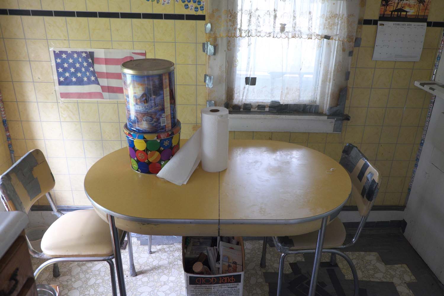  Interior view of kitchen in a house up for auction. The man who previously lived here loved duct tape. Bowen, IL. July, 2016 