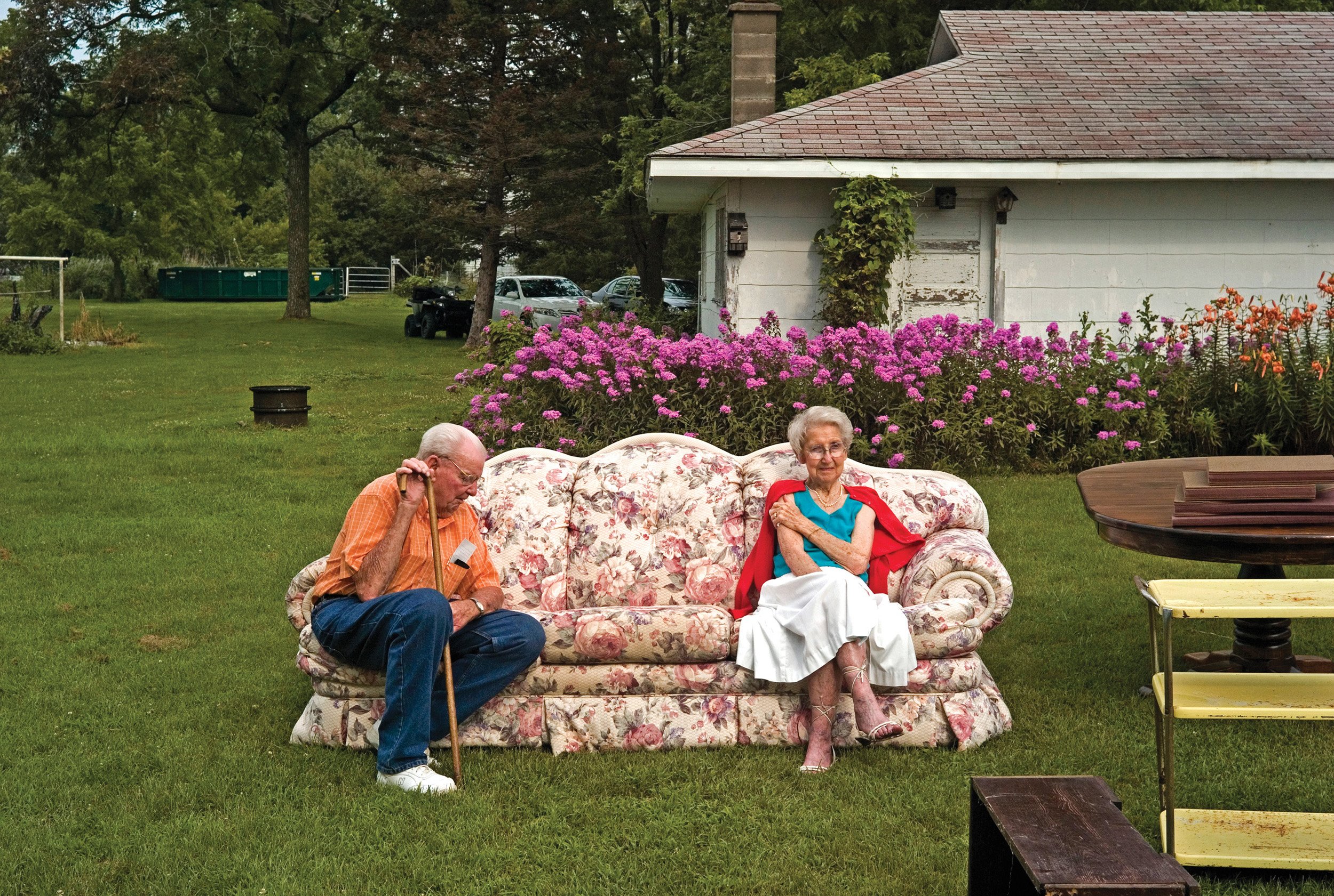 Unknown couple sitting on a couch at an auction in La Prairie, IL. July, 2011 