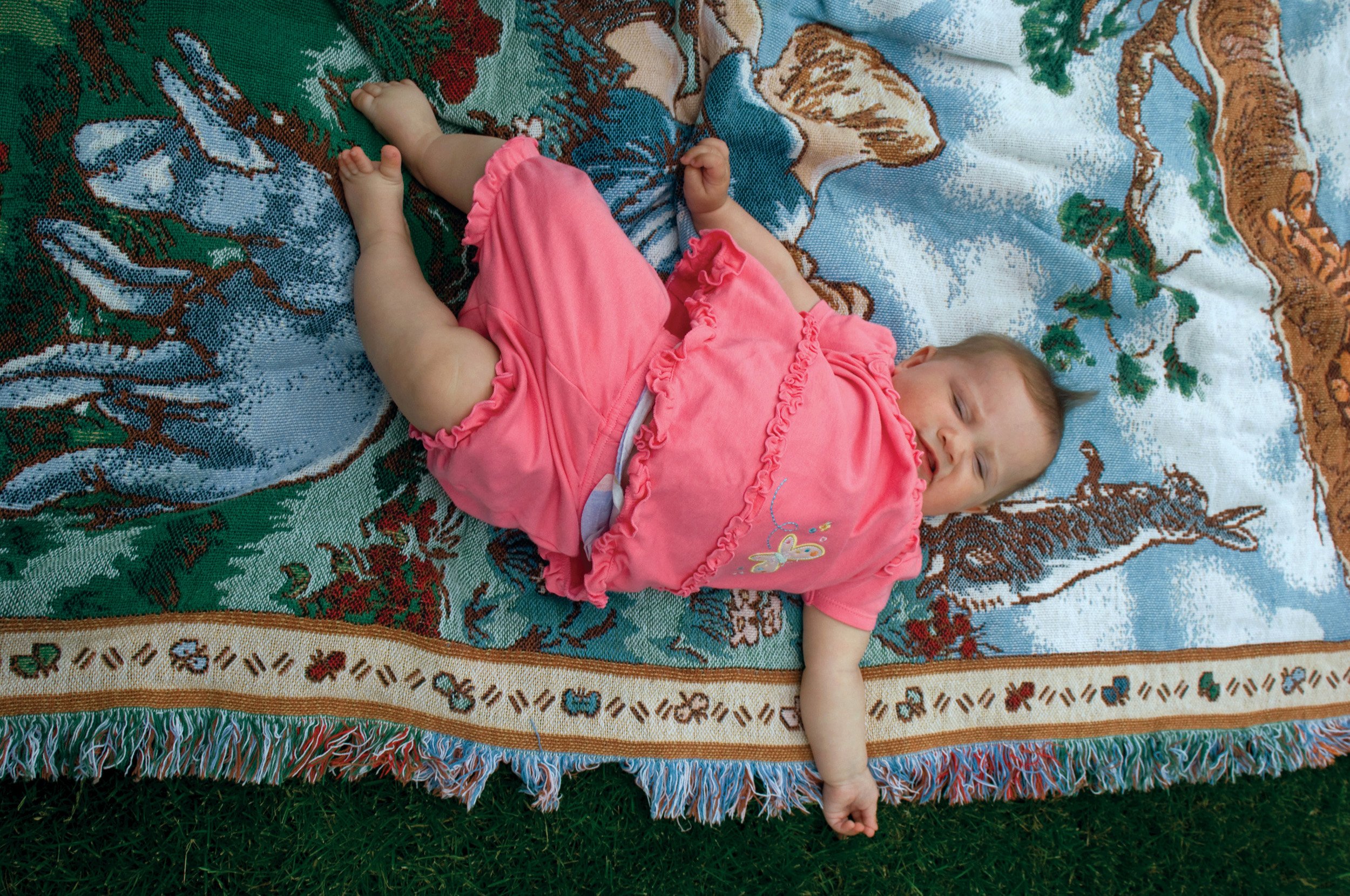  Nelson family baby on a blanket. It was the baby’s great grandmother's birthday party. Country outside of Bowen, IL. June, 2007 