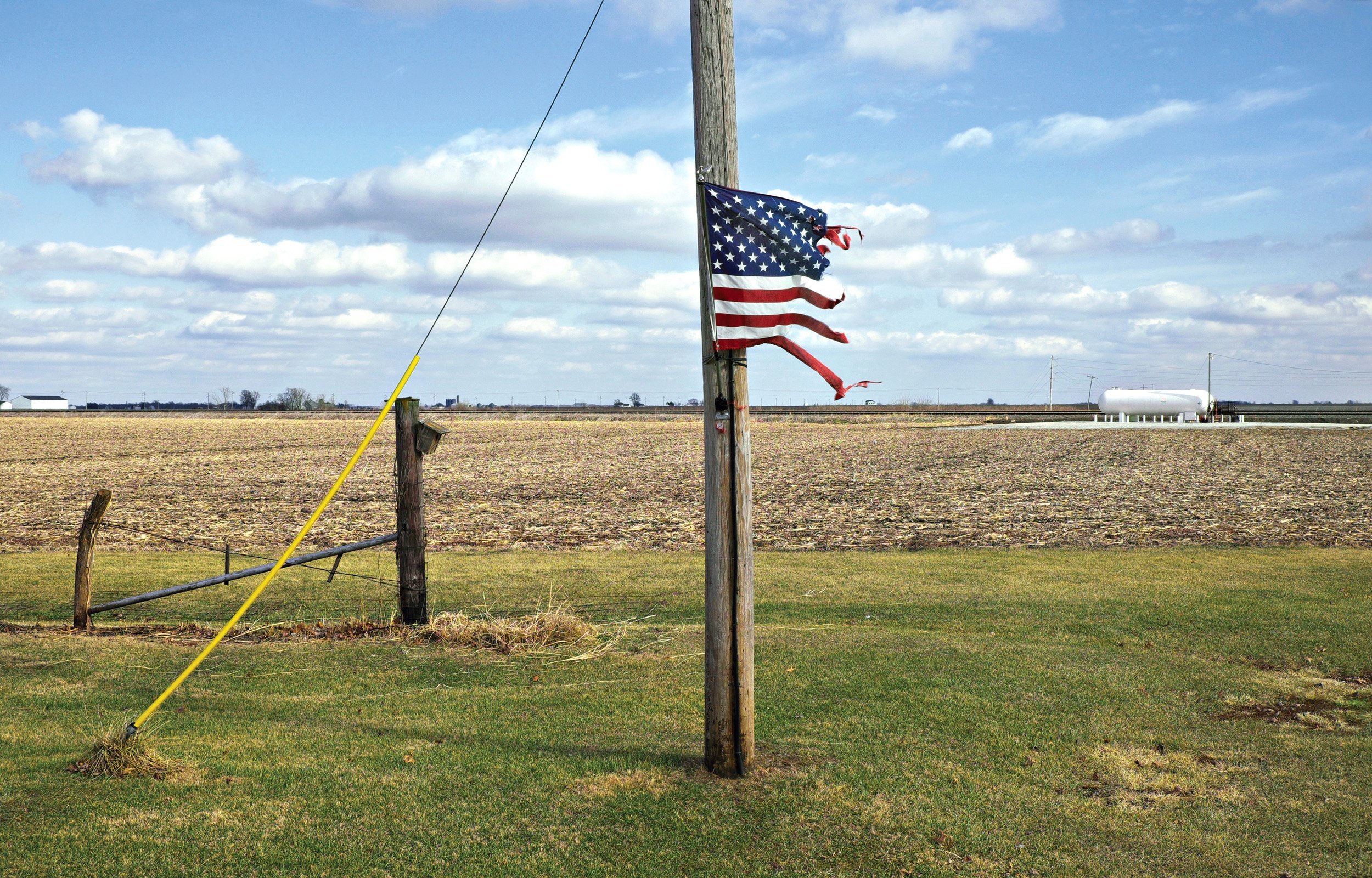  Frayed American flag on pole. Golden, IL February, 2017 