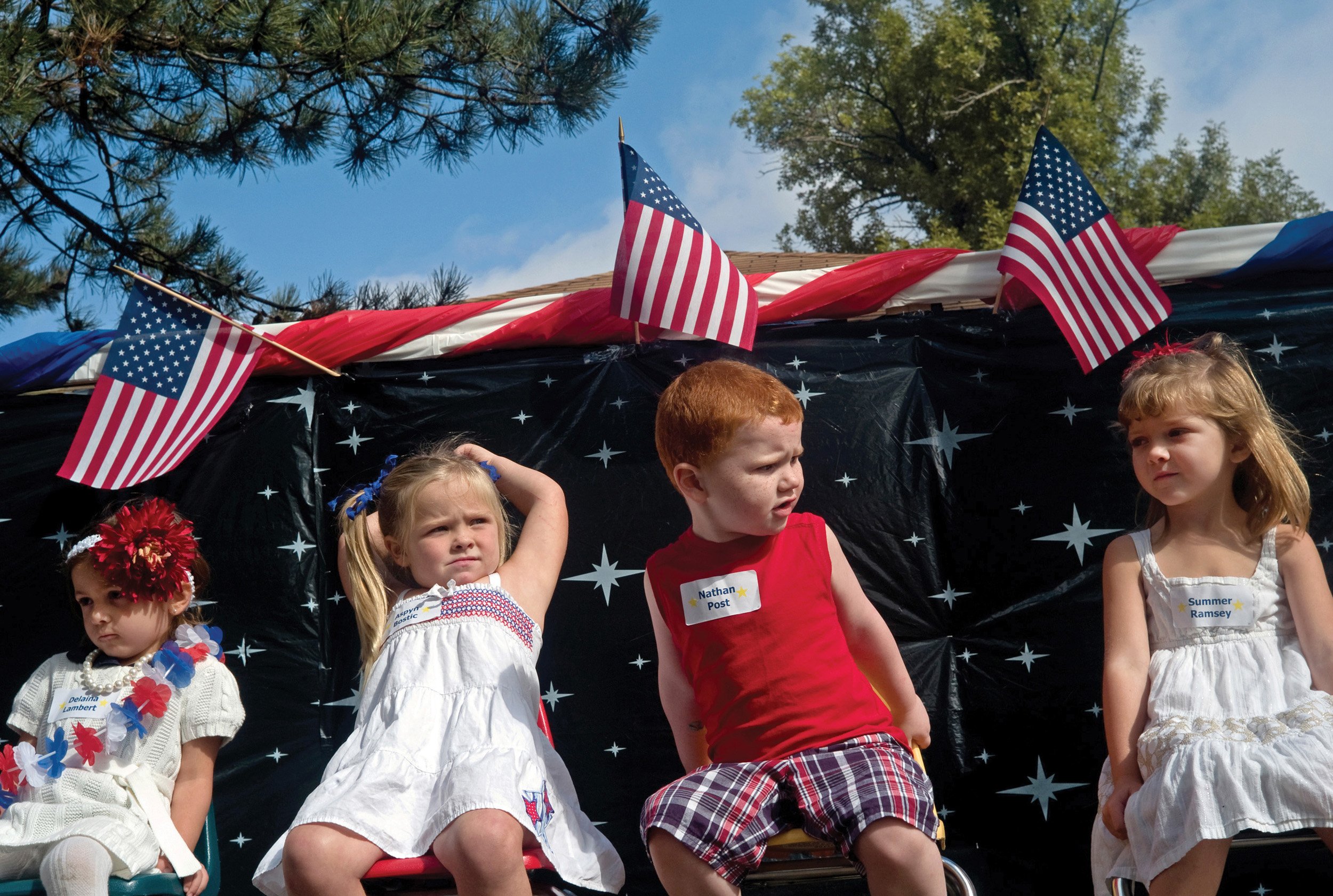  Four young children at a Fourth of July celebration. Bowen, IL. July, 2010  