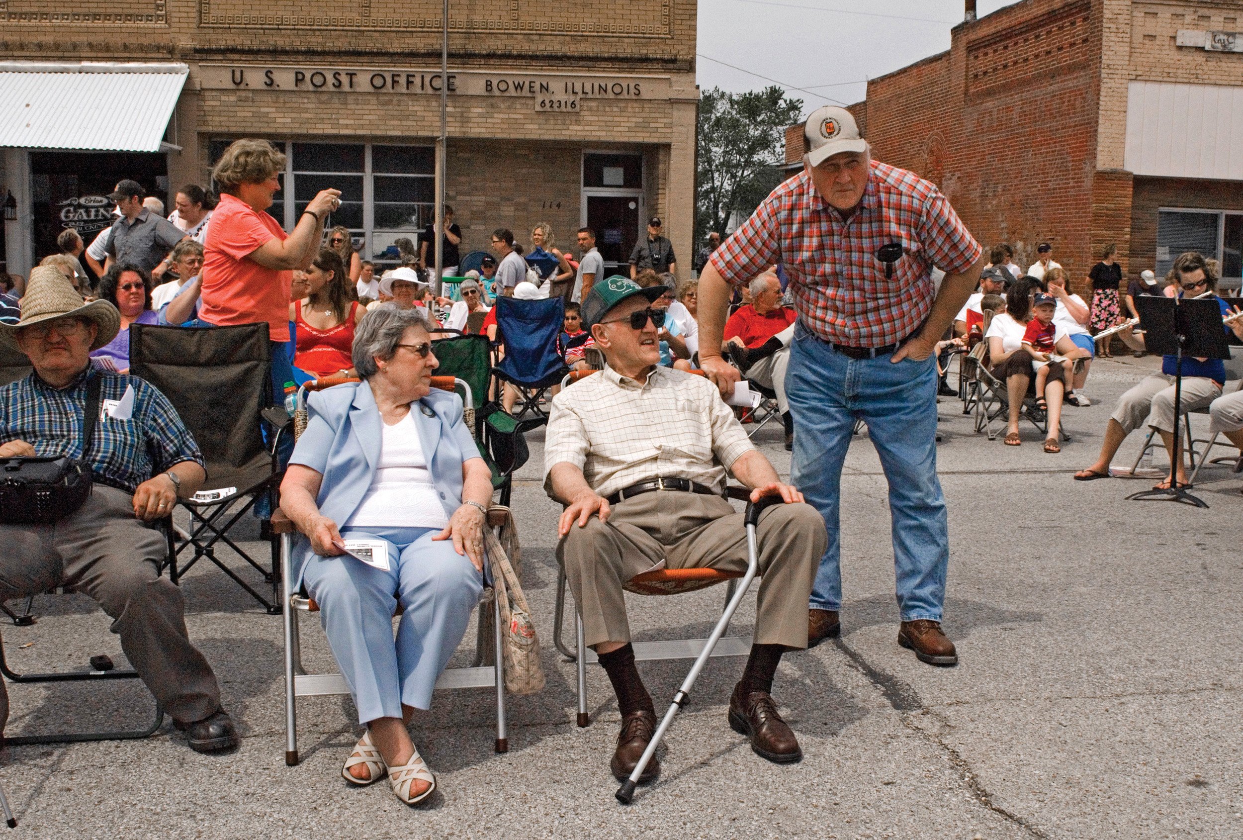  People gathering on the main street to celebrate the completion of Bowen’s Veteran’s Memorial. Bowen, IL. May, 2009 