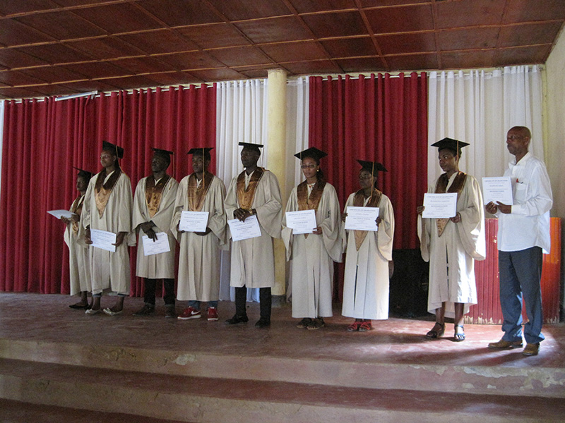 Our graduates! (The man at the far right is receiving the certificate in place of one of the graduates who was traveling in Kenya and unable to attend the celebration.)