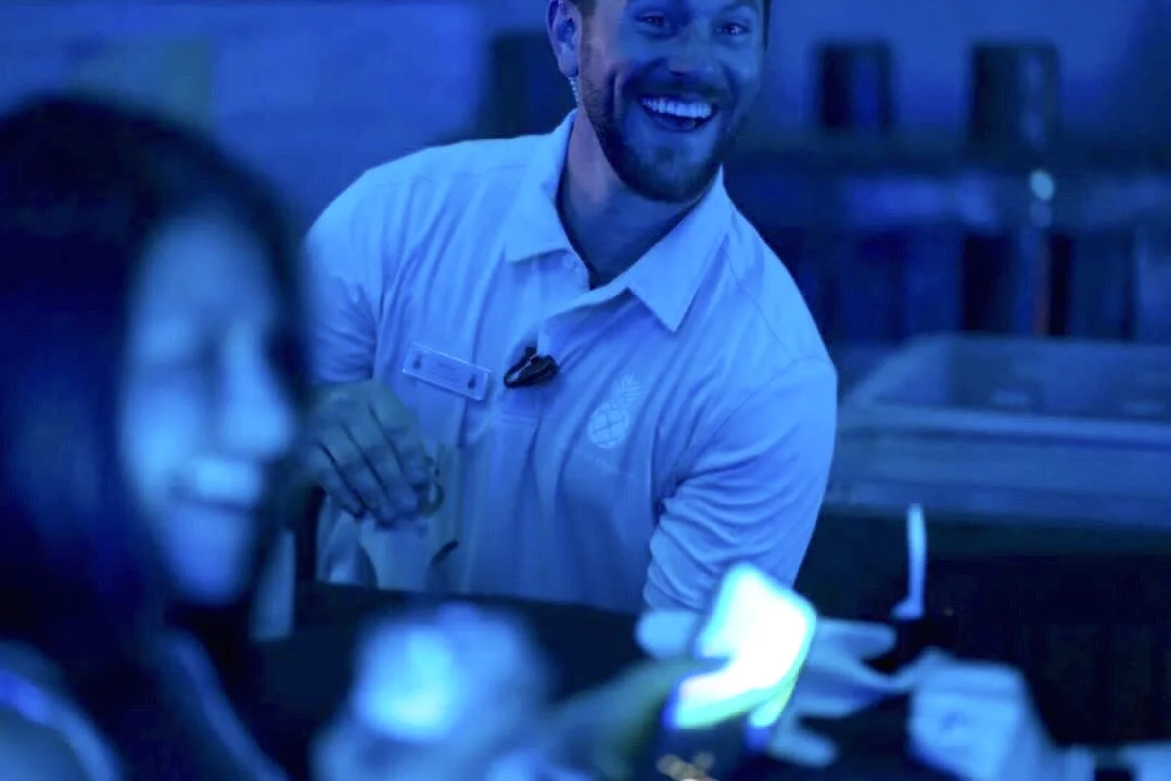 Liam, A private event bartender serving his guests with a smile!