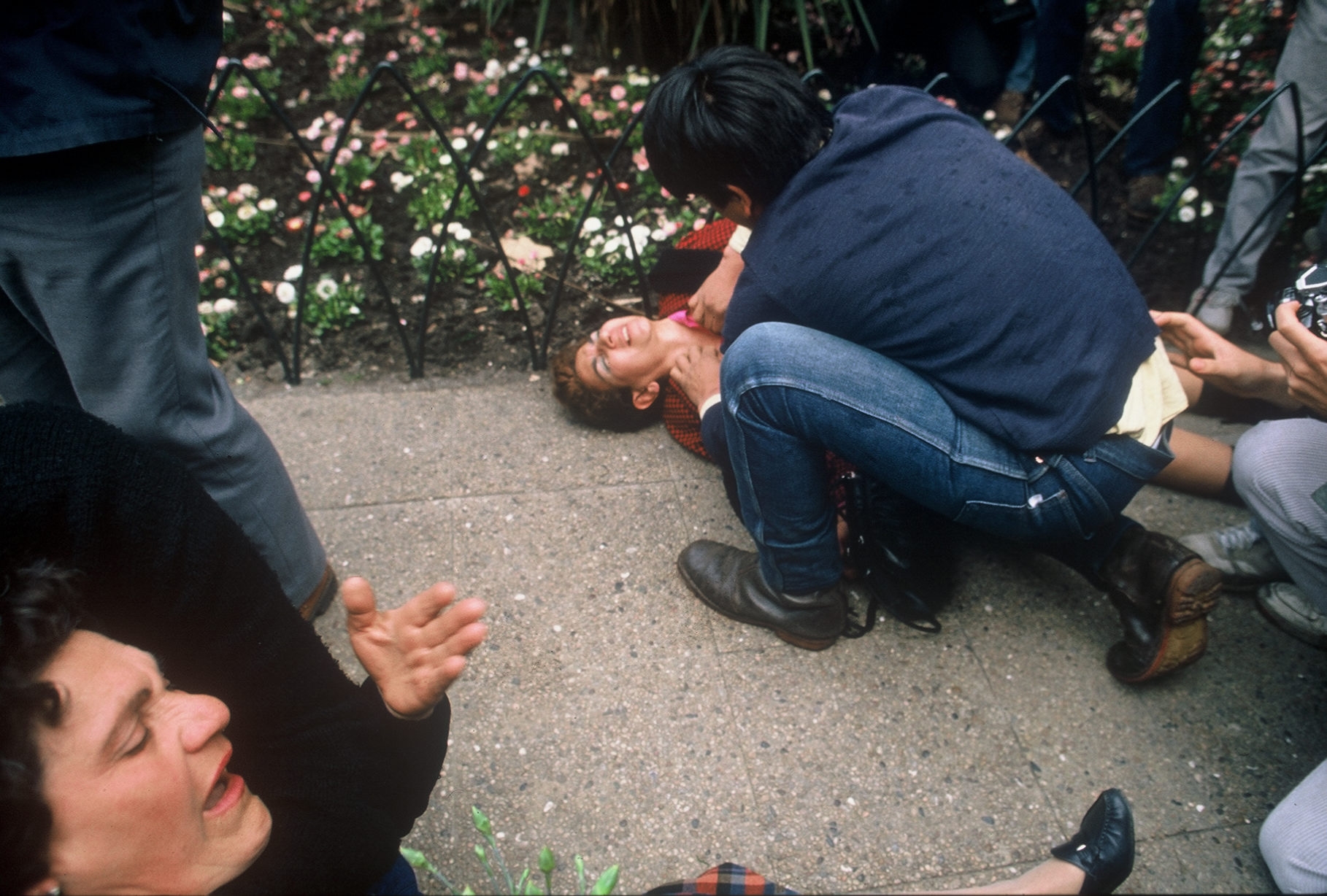 Women affected by teargas during anti-Pinochet demonstration in downtown Santiago, Chile, 1988