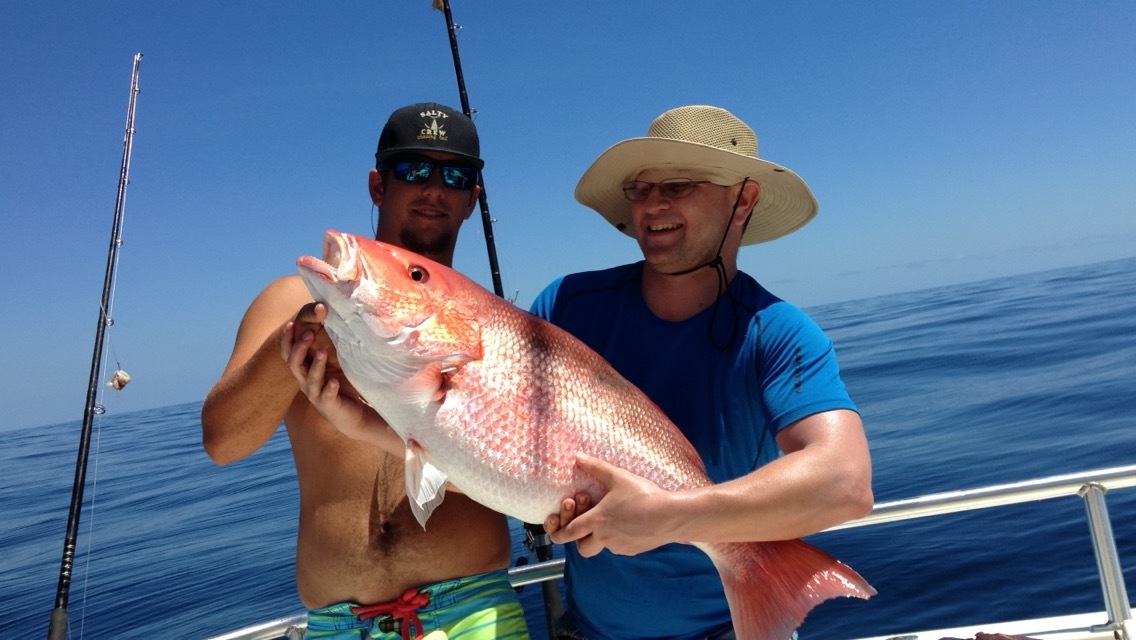 proud_fisherman_with_snapper.jpg