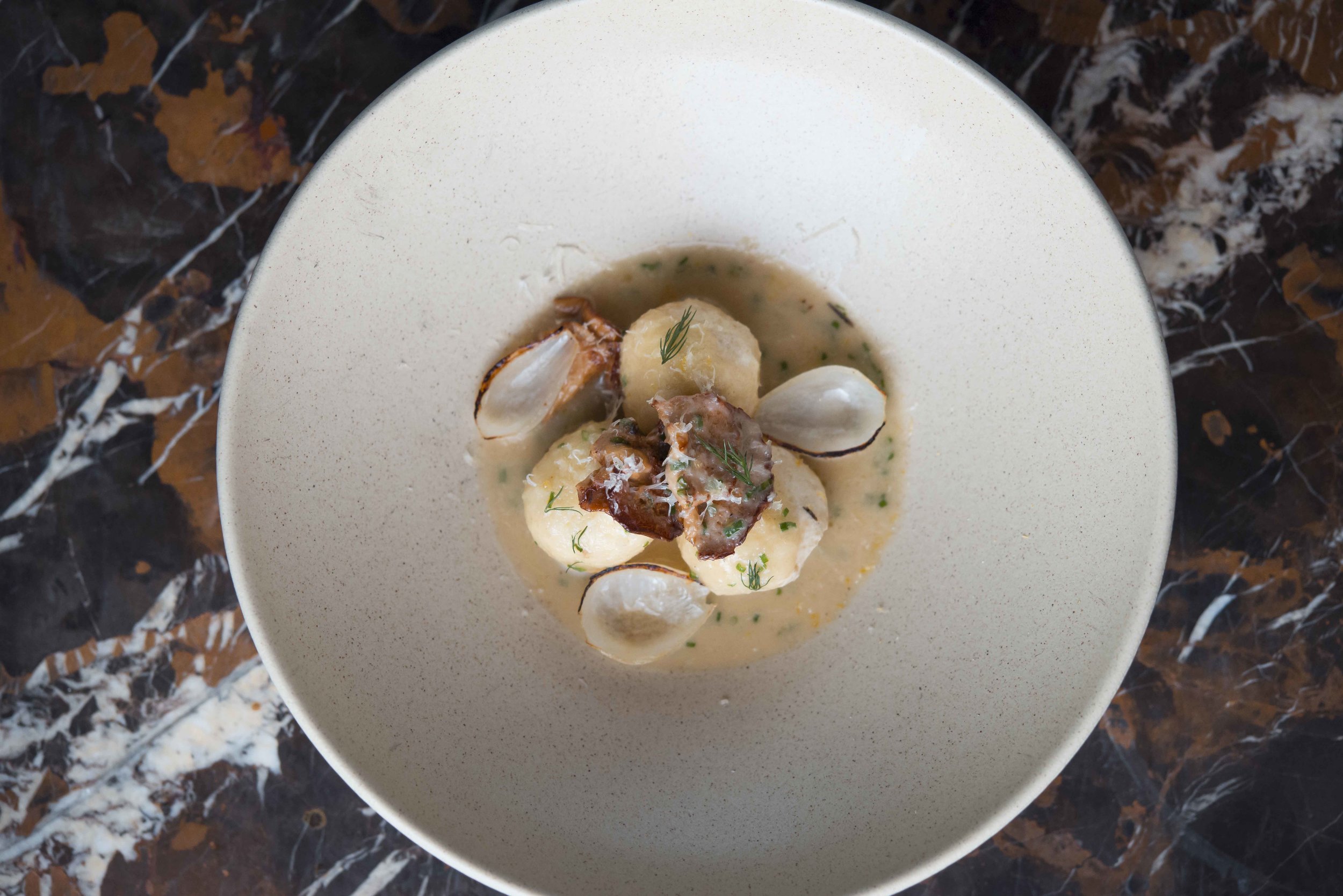 Sable | Ricotta Gnudi, Onion Broth, Chanterelle Mushrooms