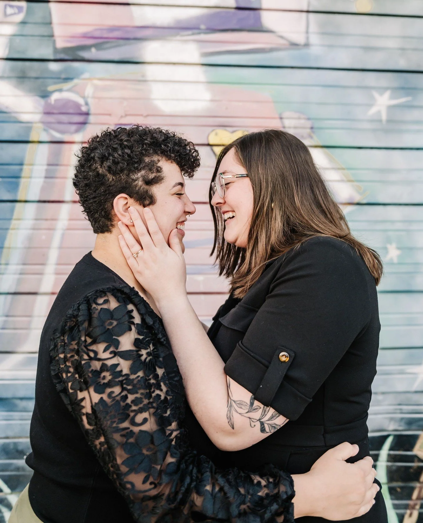 Engaged looks GOOD on Elizabeth + Bri. 🥹🖤⁠
⁠
South Main gave us the coolest backdrop - murals, brick streets, all the vibes - but honestly, nothing compares to the way these two look at each other. 🥹 The joy, the laughter, the quiet little moments