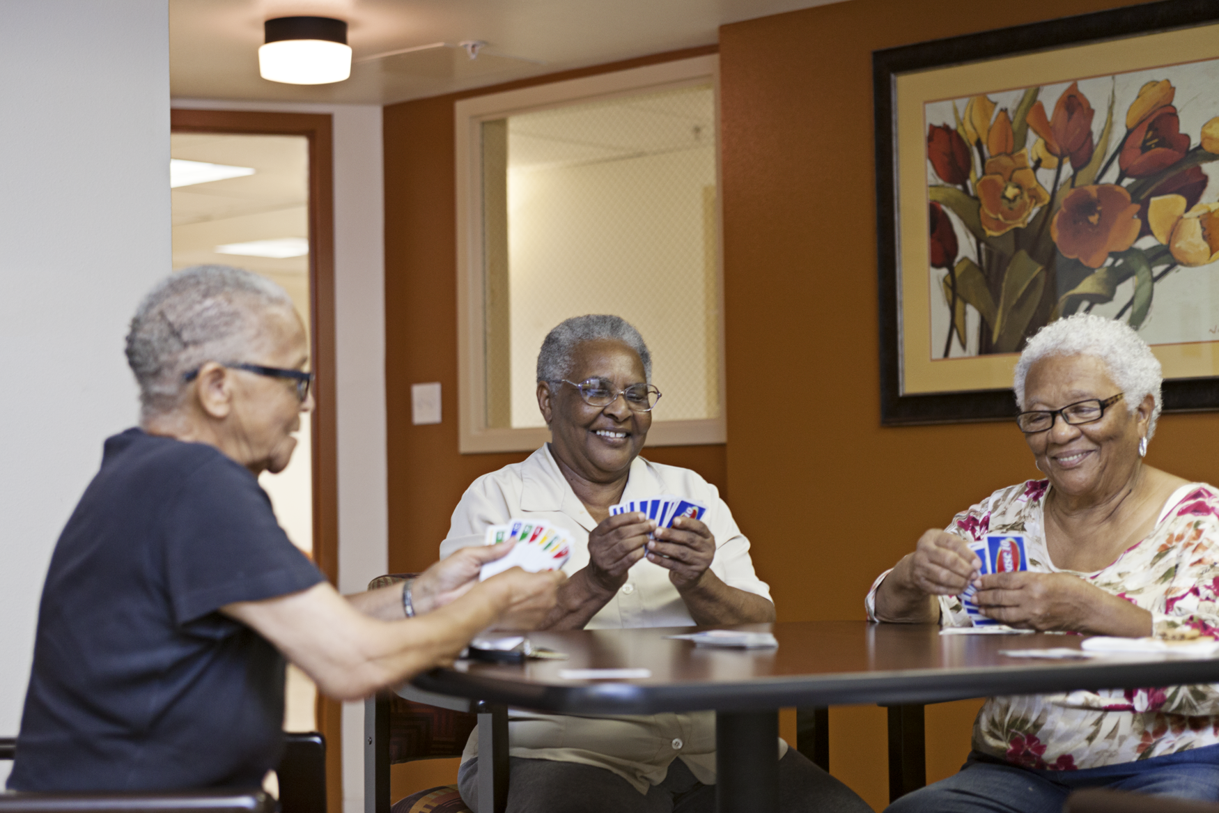 Existing stock images featuring multiple older adults predominantly depict romantic partnership. Participants wanted to portray other forms of companionship that are central to their experiences of senior life. Several participants play cards, and