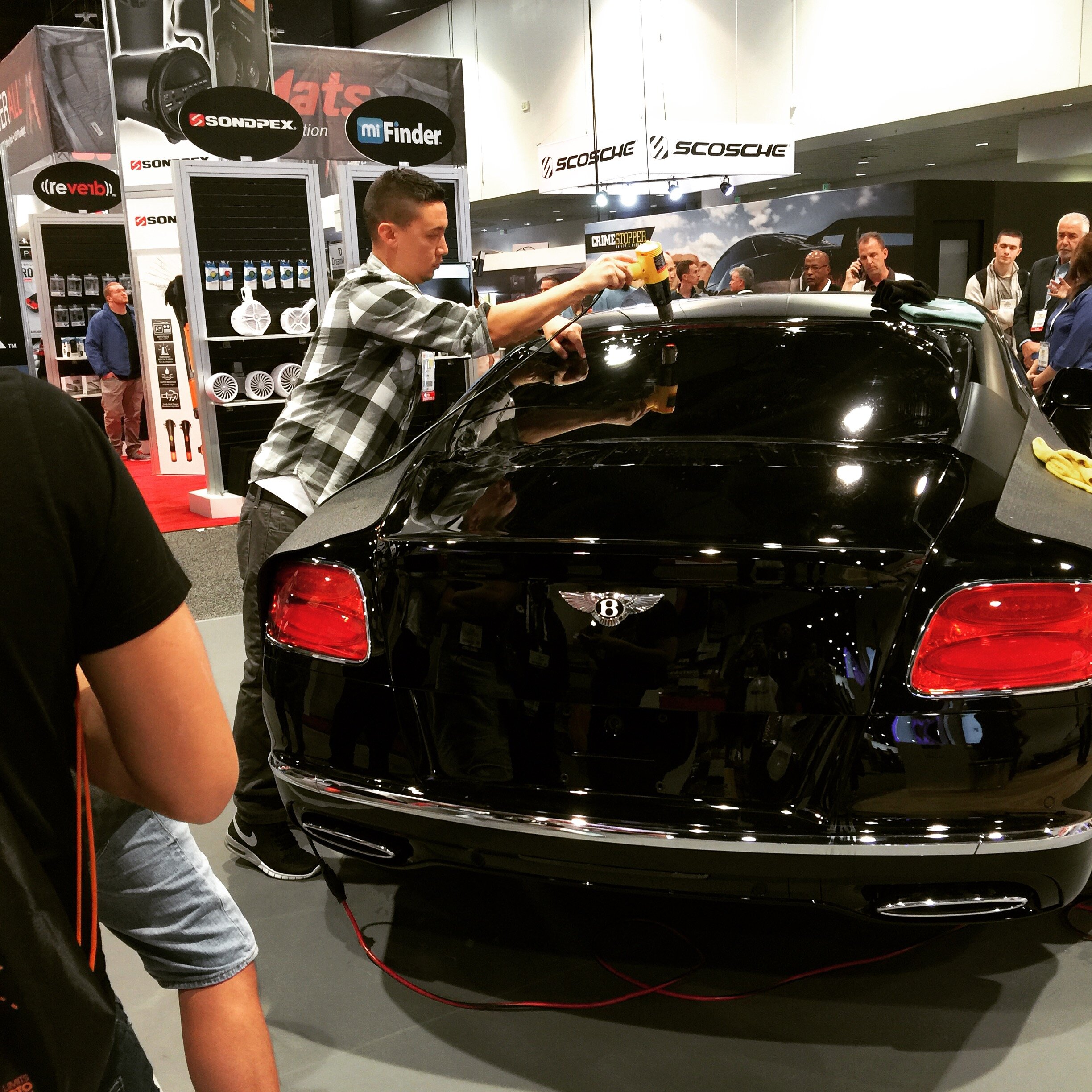 Aaron performing tint demonstrations at SEMA in 2015