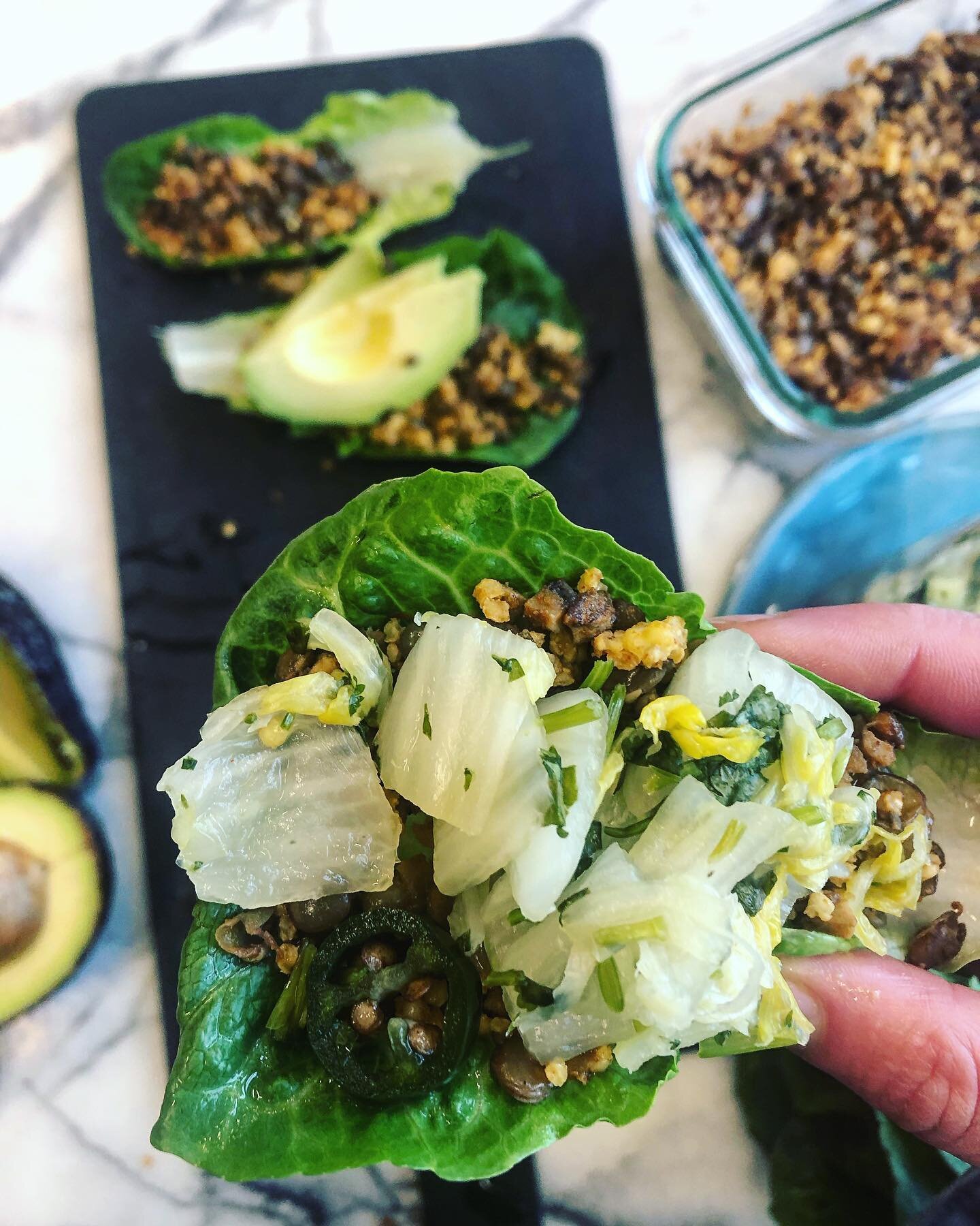 Feel good foods ☀️
Jalape&ntilde;o, Napa cabbage and cilantro ferment with a smoky millet, mushroom &amp; French green lentil Mexican style &ldquo;meat&rdquo; lettuce cups 🌮 topped with 🥑 
.
.
.
.
#living #allplants #millet #lentils #vegan #plantba