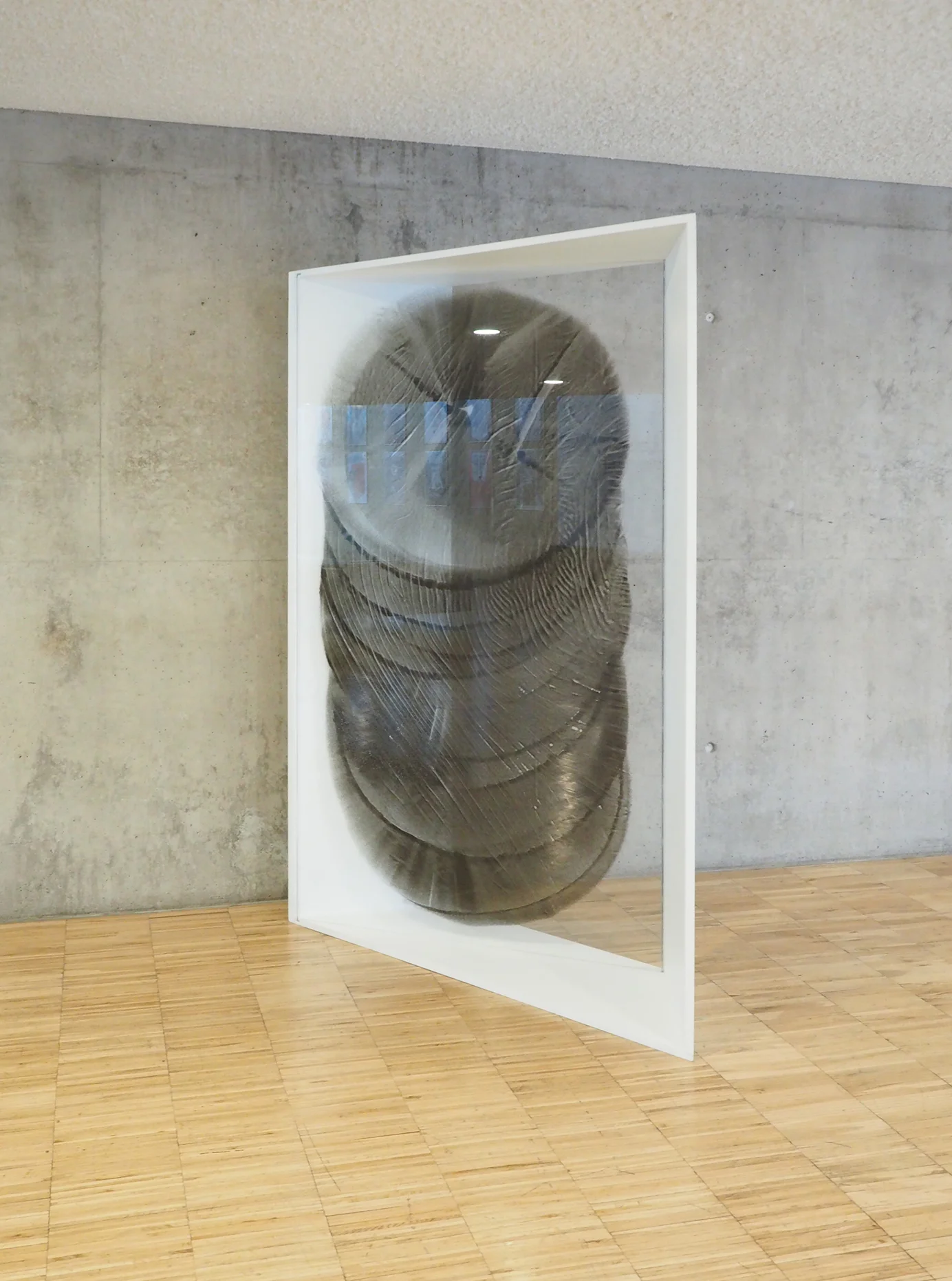 Mirafondos, 2017. Black sand insertions in glass, 204 x 141cm.