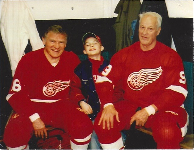 The great Gordie Howe (right) with Johnny Wilson (left) and a beaming young fan.