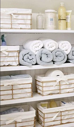Baskets in the linen closet via marinegarnier