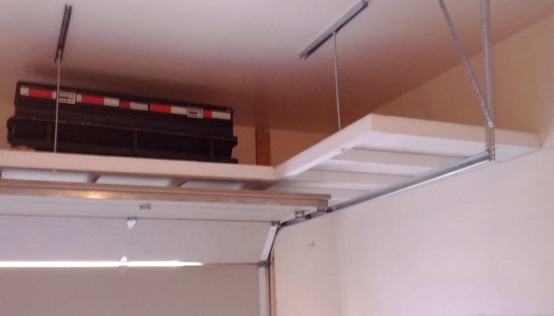 Budget Overhead Storage in wood painted white with an open underside