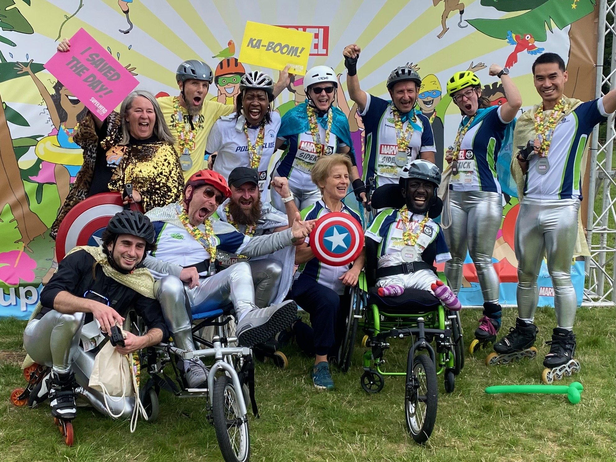 Wheels and Wheelchairs' rollerblading team/wheelchair Superhero Tri 2023 team celebrate finishing the event