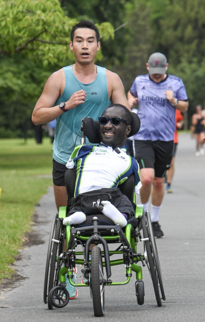 Berlin Marathon training at a Parkrun for wheelchair user Isaac and pusher Kevin. Enjoying accessible sport.