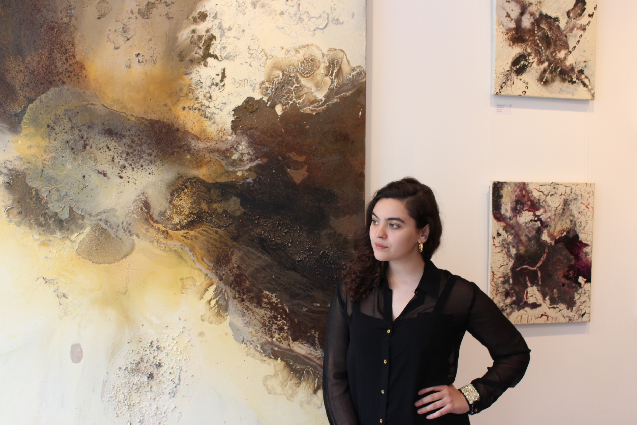 Morgane at the gallery with 'Crevice' by Maddie Rose Hills