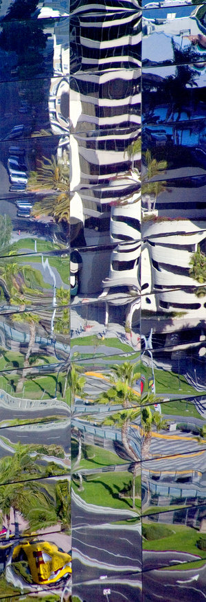 Distorted Building, archival ink print on canvas, 20" x 6.8", Edition 4/10. Abstract photograph of scattered collages of building, ground and grass.