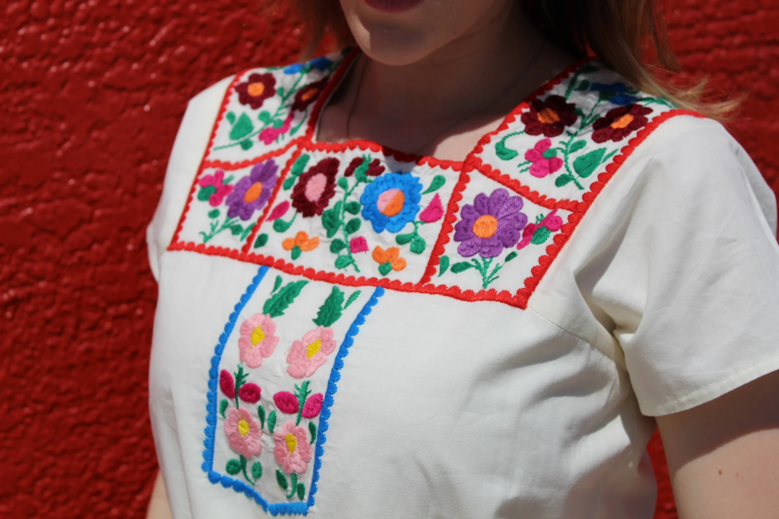 Here's an up close and better look at the detailing of the jumpsuit. It is pretty intricate and beautiful if you ask me! It's all in the details, especially when you have something that is so basic like a jumpsuit. The embroidery really helps to jazz it up and make it special.