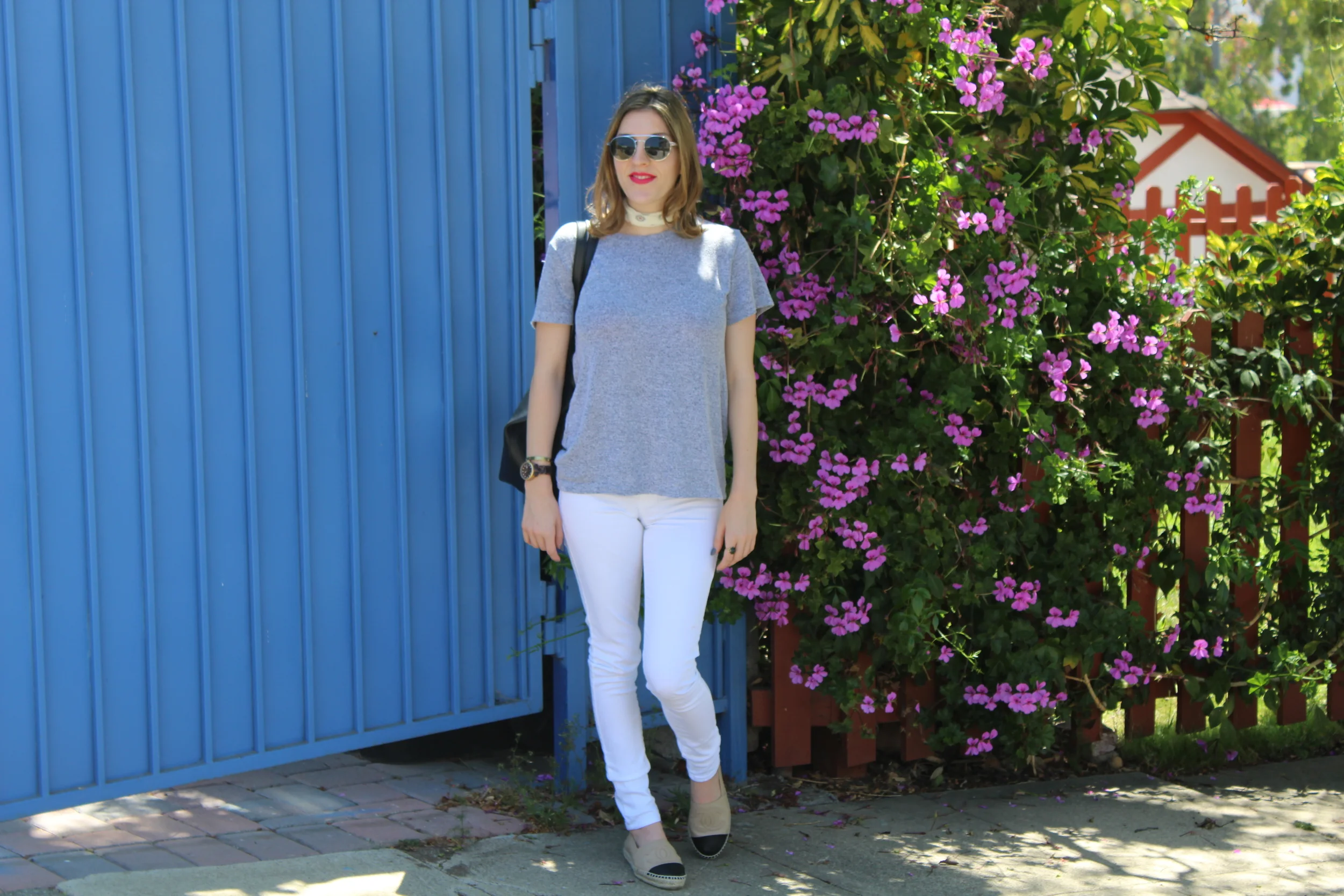 Bandana: Madewell // Sunglasses: Le Specs // Top: The Lady & The Sailor // Denim: Blank NYC // Flats: Chanel, similar here // Bag: Forever 21 (Currently $8!!!!!!!)
Normal
0
false
false
false
EN-US
JA
X-NONE
/* Style Definitions */
table.MsoNormalTable
{mso-style-name:"Table Normal";
mso-tstyle-rowband-size:0;
mso-tstyle-colband-size:0;
mso-style-noshow:yes;
mso-style-priority:99;
mso-style-parent:"";
mso-padding-alt:0in 5.4pt 0in 5.4pt;
mso-para-margin:0in;
mso-para-margin-bottom:.0001pt;
mso-pagination:widow-orphan;
font-size:12.0pt;
font-family:Cambria;
mso-ascii-font-family:Cambria;
mso-ascii-theme-font:minor-latin;
mso-hansi-font-family:Cambria;
mso-hansi-theme-font:minor-latin;}
Although white jeans and a grey tee may seem like a pretty easy concept to most people, it is the accessories that really bring this look home. Neck scarves are a big BIG trend right now. So adding it to this outfit really amped up the simplicity and put it on trend. I decided to turn the scarf around so that it was more of a scarf choker than necktie and it helped to add something unique to the ensemble. A black tote bag is my go to easy breezy bag. It holds all of my random clutter and I can even fit my camera in there too! This one that I got from Forever 21 for about $20 is such a great bag and I couldn’t beat the price! It is so functional and you can’t go wrong with black. It goes with everything and can be worn all year long. I even use it as an overnight bag, a beach bag, and even a carryon for travel. Adding a pair of cool sunglasses always takes any look to the next level. Round sunglasses are a big trend right now as well and add an instant cool factor when worn. I have mentioned this several times in previous posts, but I love this pair of Le Specs glasses. They just fit so perfectly and are so lightweight! You will definitely be seeing more outfits paired with these sunglasses. Last but not least, I added my Chanel espadrilles to this outfit. They paired nicely with the white jeans and added a summery feel to the look. Plus the black cap toe matched up nice with my tote. These shoes are made of the most buttery lambskin leather and are super comfy to boot! These are my go to summer shoes as of late! This look can easily be transitioned into fall by adding a wool fedora, most likely I’ll be showcasing something similar in the fall wearing my favorite rabbit fur fedora. And whoever said that white jeans couldn’t be worn after Labor Day is certainly wrong in my book. White jeans have become a staple in most women’s wardrobes and are worn all year long. In cooler months I’ll be sporting this look but just layering on an oversized cardi and some tall boots or booties! Thanks for reading and keep following for more new looks!!! Ciao!!! xxNicole