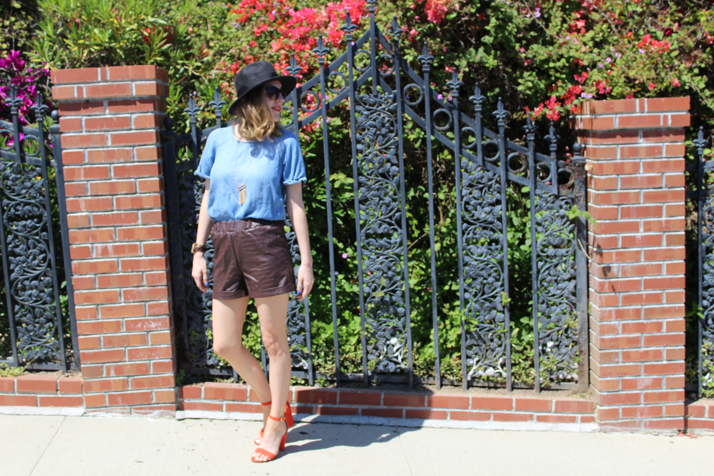 Hat: Goorin Brothers, similar here // Sunglasses: Chanel // Necklace: Forever 21 // Top: Forever 21 // Shorts: Asos, similar here // Shoes: Bamboo Happy Friday!! We made it!! Summer is now in full swing and there is no better time to pull out the cute shorts!!! These brown croc effect shorts are my ideal short for summer. I am use to wearing jean shorts during the summer, so it is nice to have a dressier pair in my wardrobe. The croc effect of these faux leather shorts adds a unique touch and I love the roll up and pocket details as well! These shorts are perfect because I can dress them up by adding a heel or keep them casual by pairing them with a white tee and flat sandal. They are also an easy piece to take into the fall months when it is still warm, but cooling down. I can pair a sweater, a scarf, a hat like the one I am wearing above, and a nice bootie and still keep the look appropriate to the season. Thanks for stopping by and keep following for more new looks!!! Ciao!! xxNicole 