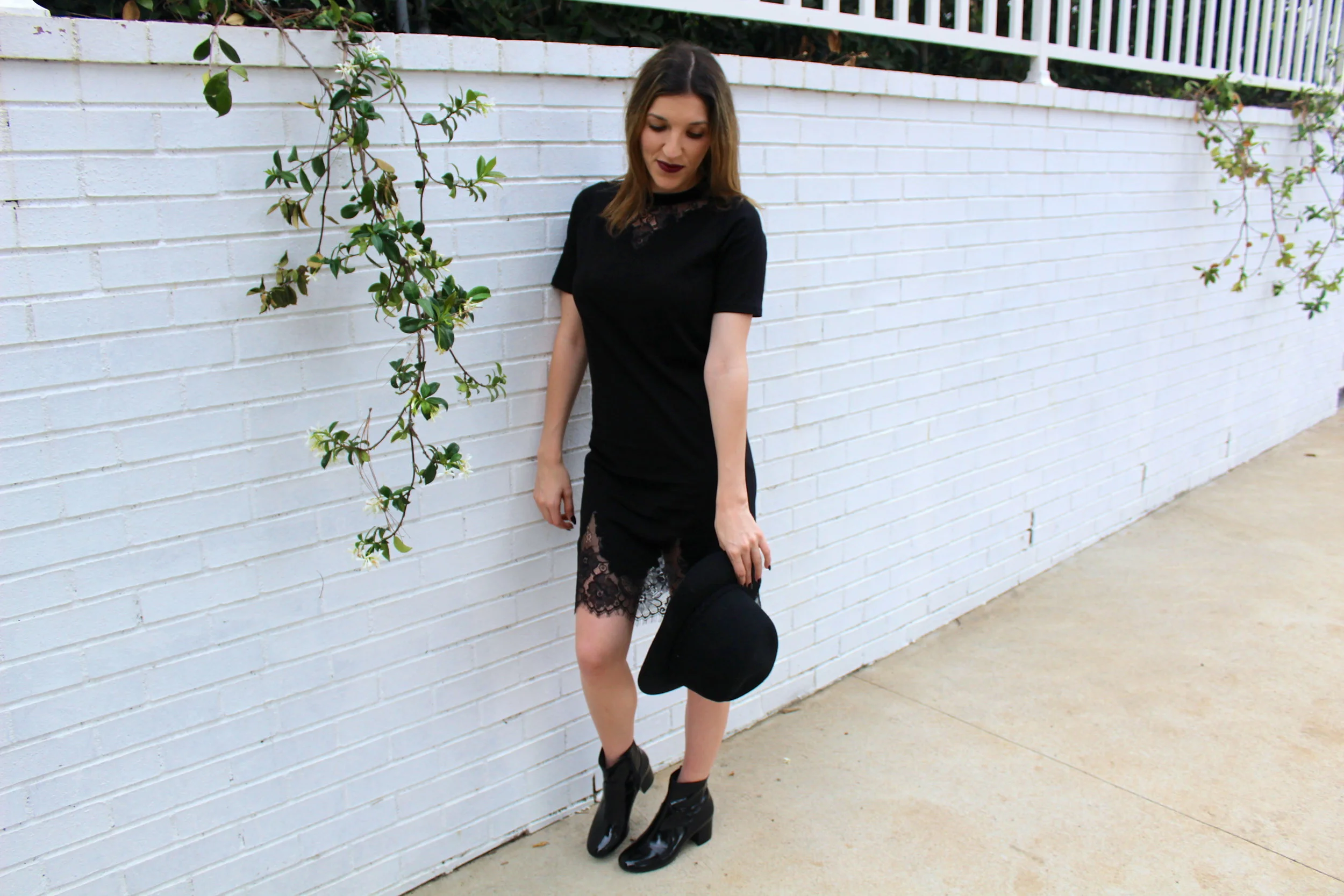 Dress: Asos , similar here // Boots: Nine West // Hat: Forever 21, similar here Wow! The campaign trail is finally over, and I guess you could say this look expresses my mood about the outcome. I do not like to talk politics, but i had to get that off my chest. On to something I do love to talk about is fashion. A little black dress is a piece that you can keep and love forever. Throwing some lace into the mix doesn't hurt either. This dress is as simple as can be, I mean its just a t-shirt dress, but it has all the feminine details you will ever need. The lace is so beautiful sitting at the bottom of the dress and then a little cut out at the top and the fit although just a straight cut, is very flattering on the body. I added a patent leather boot and a wool fedora, to amp up the look but also keep it simple as to keep the main focus on the dress. Thanks for dropping by! xx Nicole