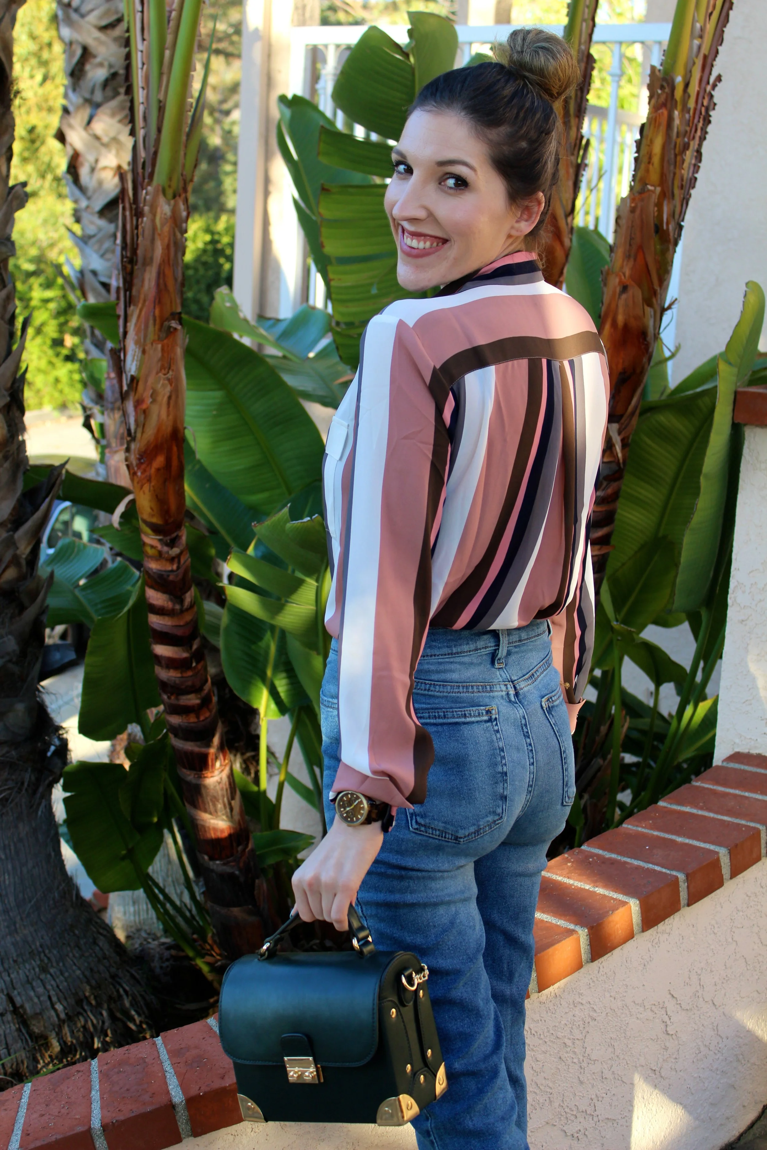 Top: Ann Taylor, similar here // Jeans: BDG // Shoes: Forever21 // Bag: Forever21, similar here // Watch: Michael Kors Happy Tuesday! I hope everyone out there had a lovely 3-day holiday weekend! All of the items I am wearing in this blog post are some of my new favorite pieces that I have been wearing on repeat. I am in love with these "mom" style jeans! They are actually more flattering than I thought they would be. I can't stop wearing them, the denim is so soft and I love the silhouette they give the body, even when just wearing flats. A perfect on trend jean to wear right now! Anyone who knows me or follows my blog knows I love stripes! Any color, any style, on anything! This top is perfect for work or play, I use it for both and I love the dusty pink color too! Definitely a style to keep in your arsenal! The mule trend is so popular right now that I had to snag myself a pair and I love these ones that I got from Forever21 that are under $25. I wear them all the time! They are very comfortable and just the right heel height to be comfy in all day! I picked the grey color to shake my shoe collection up a little bit, but I am very happy that I did because the color pairs with everything and anything! Most of these pieces are currently still available, but I have linked very similar ones if they are not. I suggest trying out a few or all of these trends and pieces and I am sure you will be wearing them on repeat just like me! Thanks for stopping by y'all! ~ Nicole