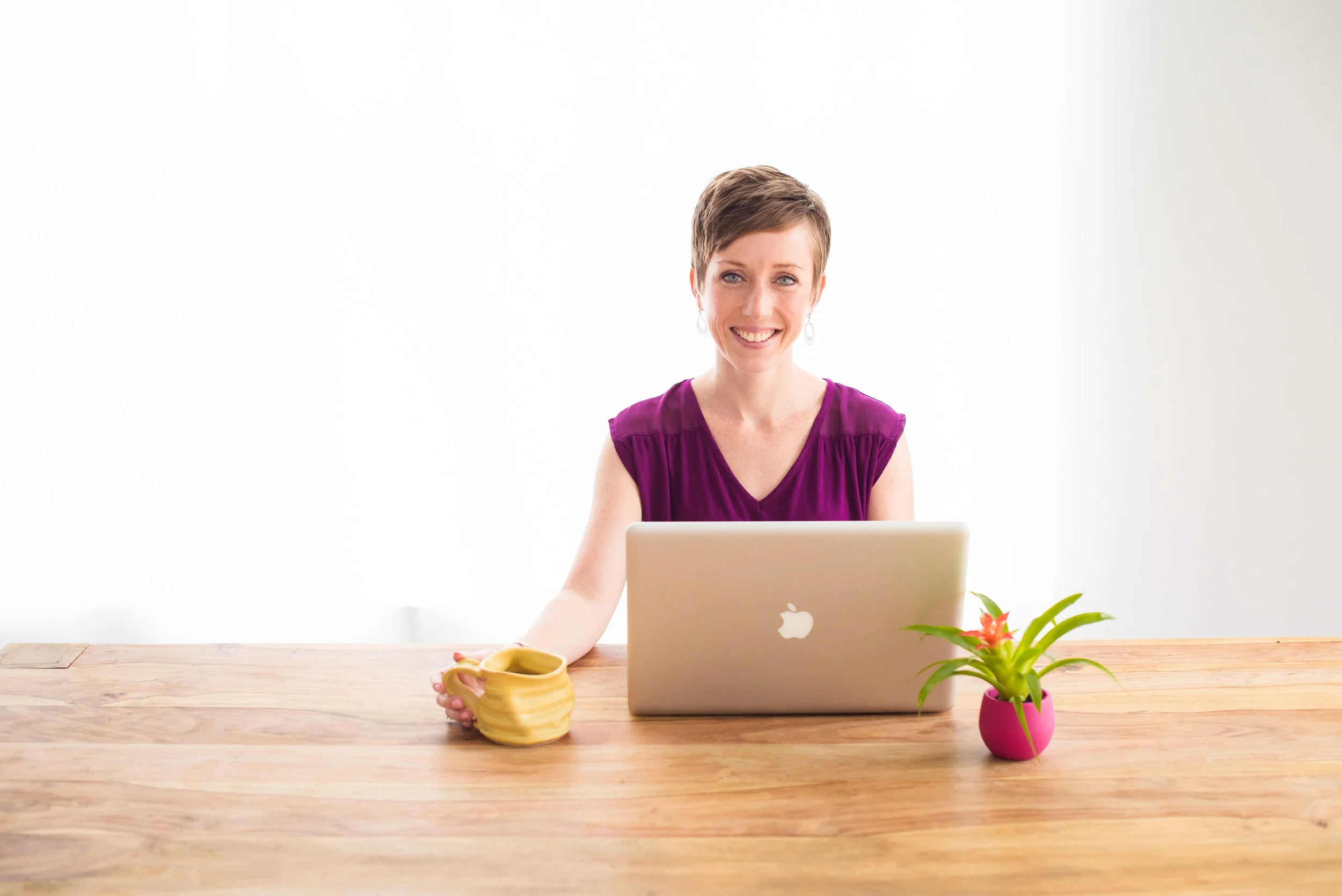 Horizontal - desk, hand on mug.jpg