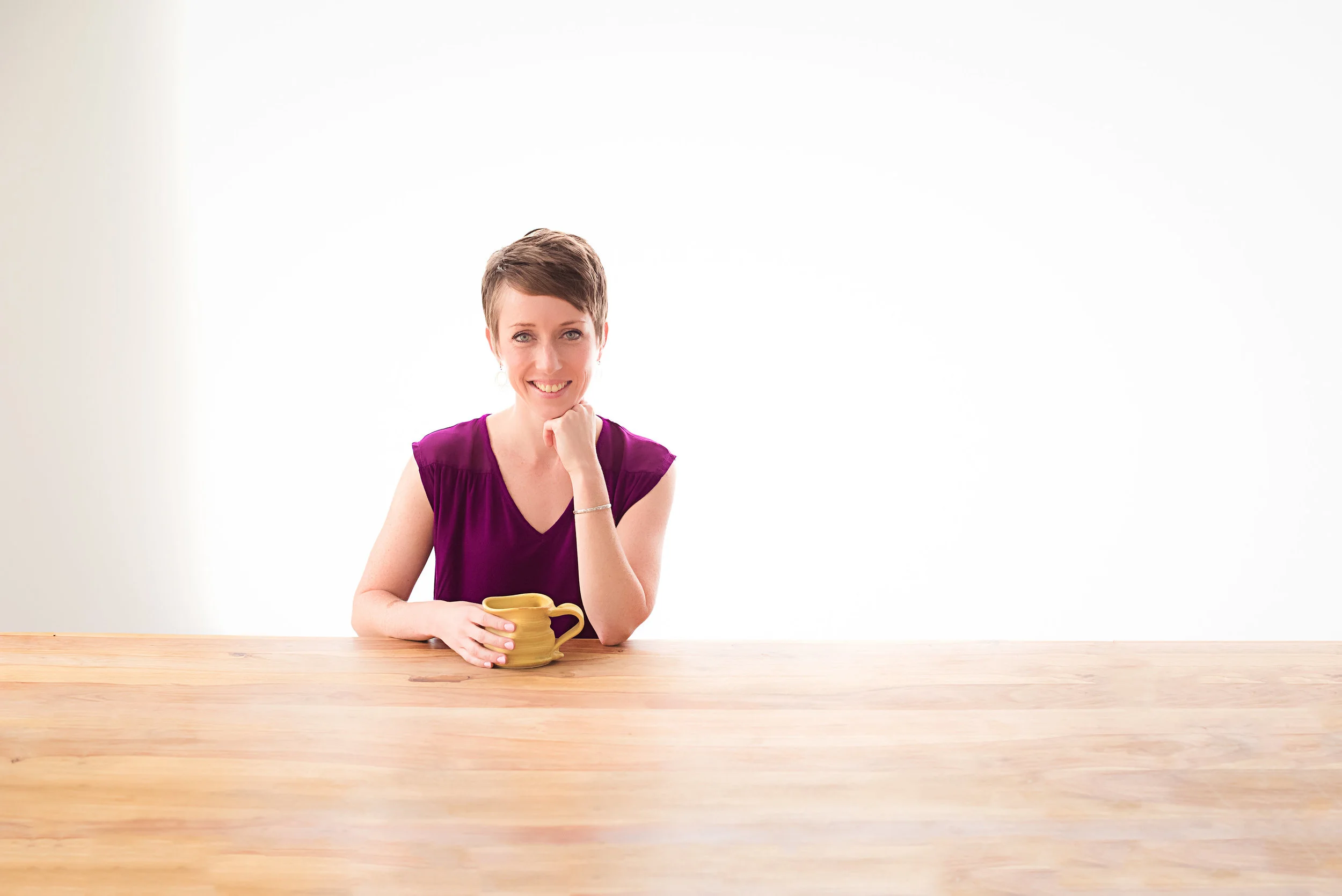 Horizontal - desk, hand on chin.jpg