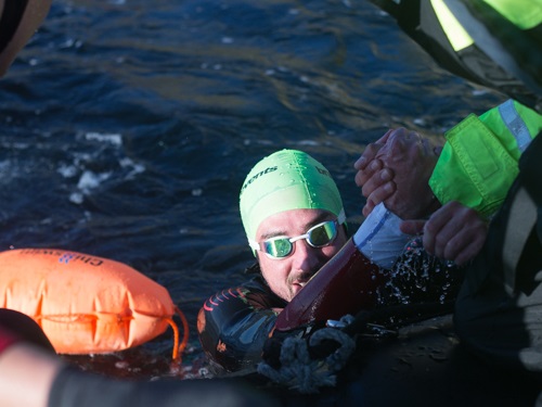 Robbie getting hauled out of the water - Saltstraumen Swim - Credit to Erlend Bodo Nu.jpg