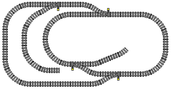The enormous passing loop on the left hand side gives us two route options; a train traveling to the left at the top of the plan may go straight through the switch for a short route, or go through the diverging side and travel the long way around the whole of the layout. Also note the two stub-end sidings; the one on the left is long enough to hold an entire train!