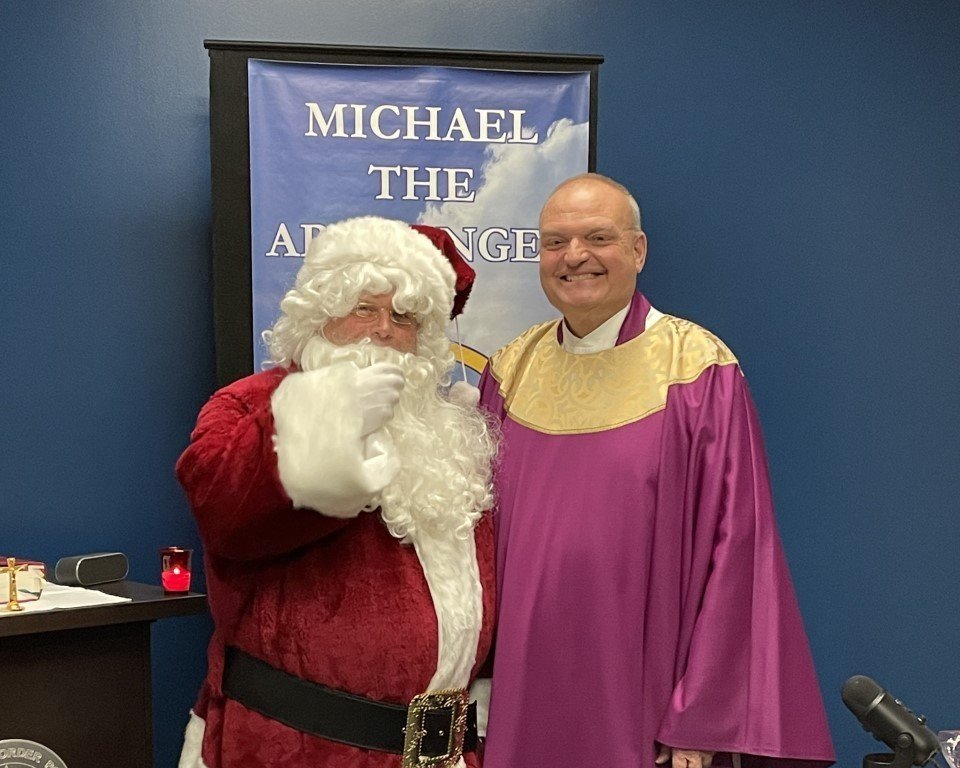   Fr. Steve Wetzel, OSFS  with Santa! 