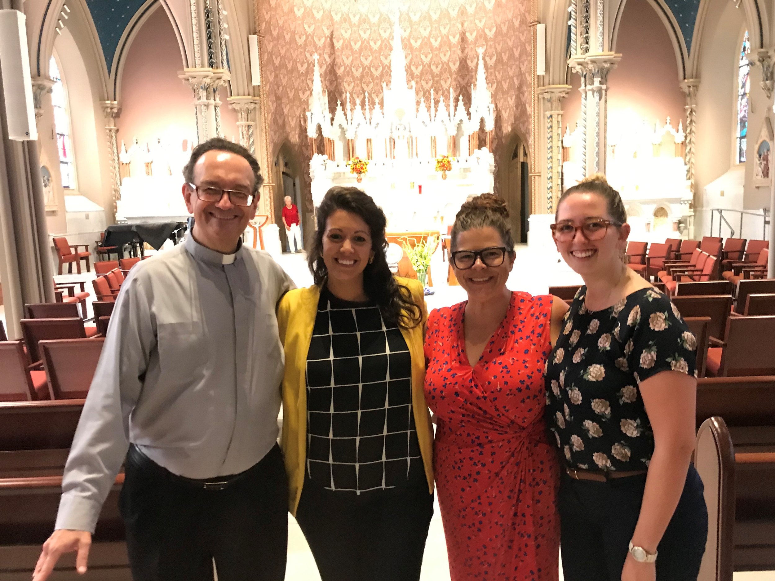  Rev. Robert Mulligan, OSFS, (Left) enjoys his role as chaplain for Chestnut Hill College. He is joined by his campus ministry teammates, Ms. Jaclyn Newns, Director of Campus Ministry, Ms. Cara McMahon, Assistant to the President for Mission and Mini