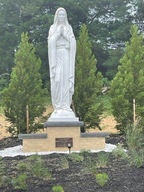 OLH with memorial plaque in base with white stone trim.jpg