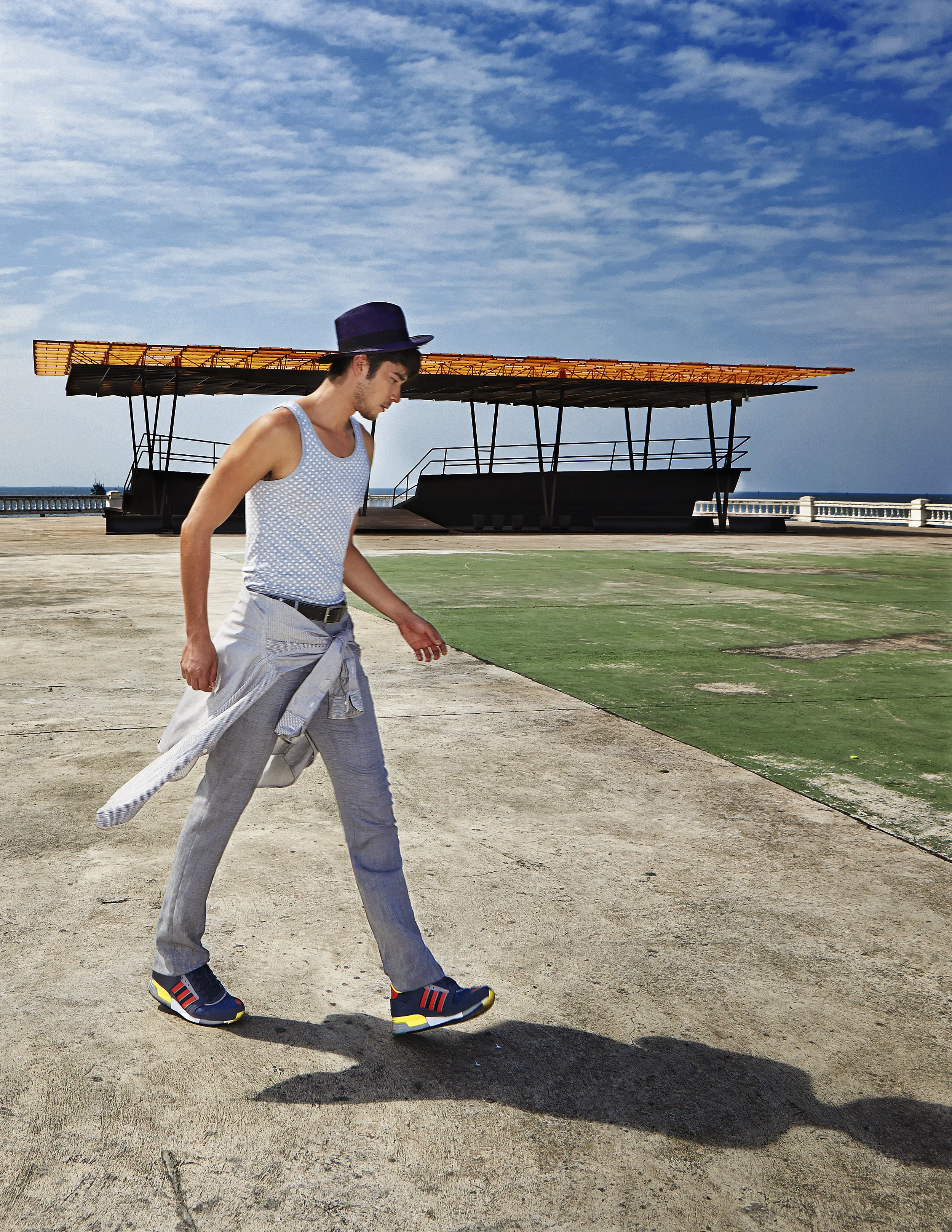 Model : Kenta Sakurai @kentasakura Pants : 4X4 MAN ศาลาอเนกประสงค์ “The Flow” ศาลาอเนกประสงค์แห่งโครงการ A Place We Stand 100 ปี ตราช้าง ที่ให้ทุกความสุขมีพื้นที่ของตัวเอง มีโครงสร้างคล้ายกระดาษพับ เป็นพื้นที่สำหรับกิจกรรมชุมชน โดยมีหลังคาซ้อนกันเป็นชั้นๆ ให้บังเงากันเองและมีช่องว่างระหว่างแผ่นให้ลมพัดเอาความร้อนไหลระบายออกไปโดยเร็ว ศาลานี้ออกแบบโดยคุณทวิตีย์ วัชราภัย เทพาคำ
