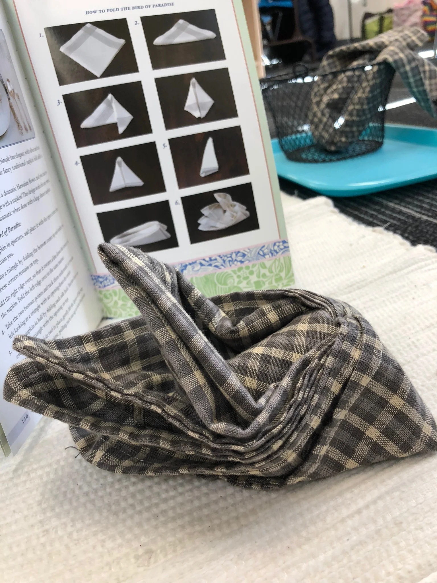 Part of the practical life curriculum is a fun one around holiday time: napkin folding.