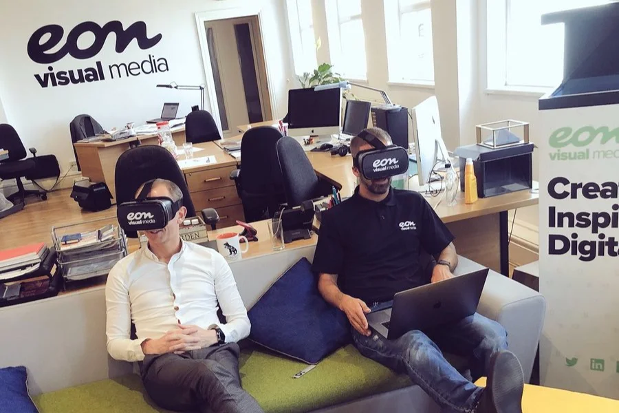 Managing Director Matt Dass and James Cherry, Head of App, Design and Web, modelling VR headsets.