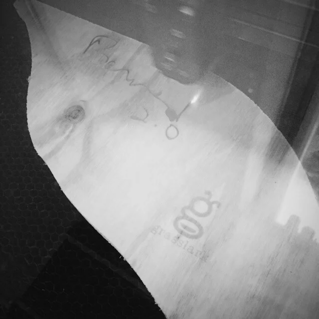 laser engraving the brand name.