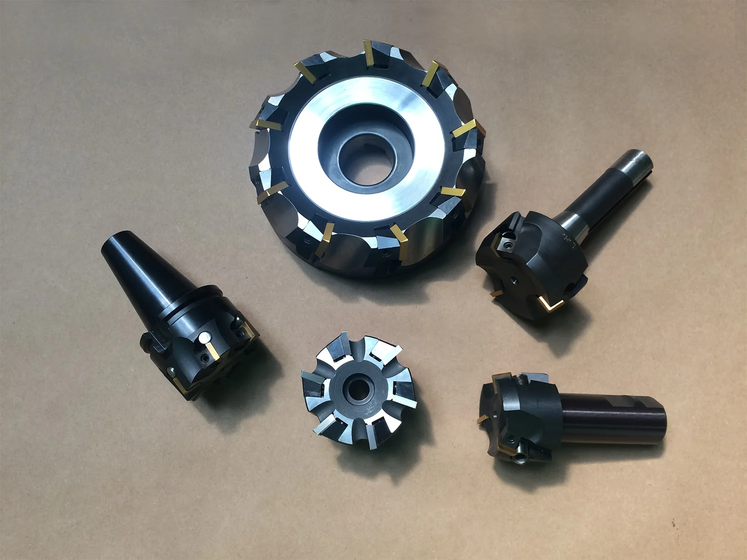 3 shank style and 2 flat back milling cutters