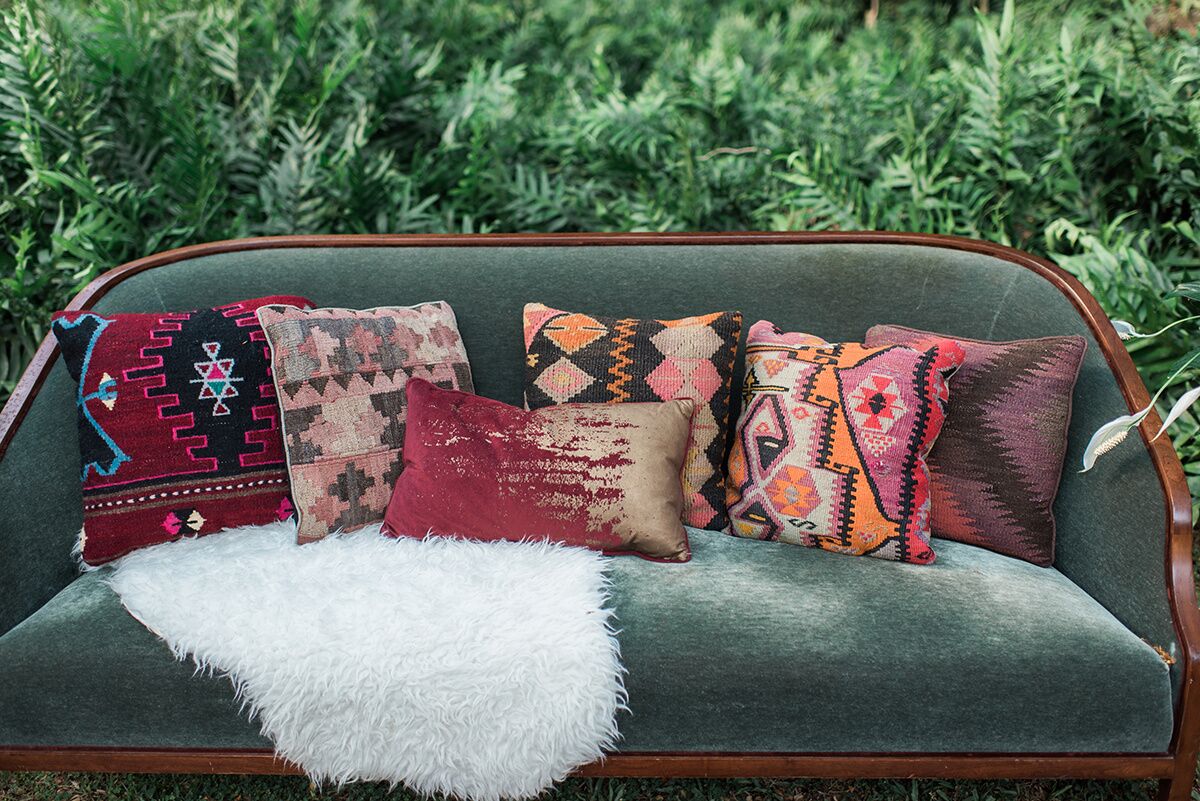 Emerald Velvet Sofa , Pillows , & Faux Fur Sheep Skin Photo Courtesy of Rae Marshall