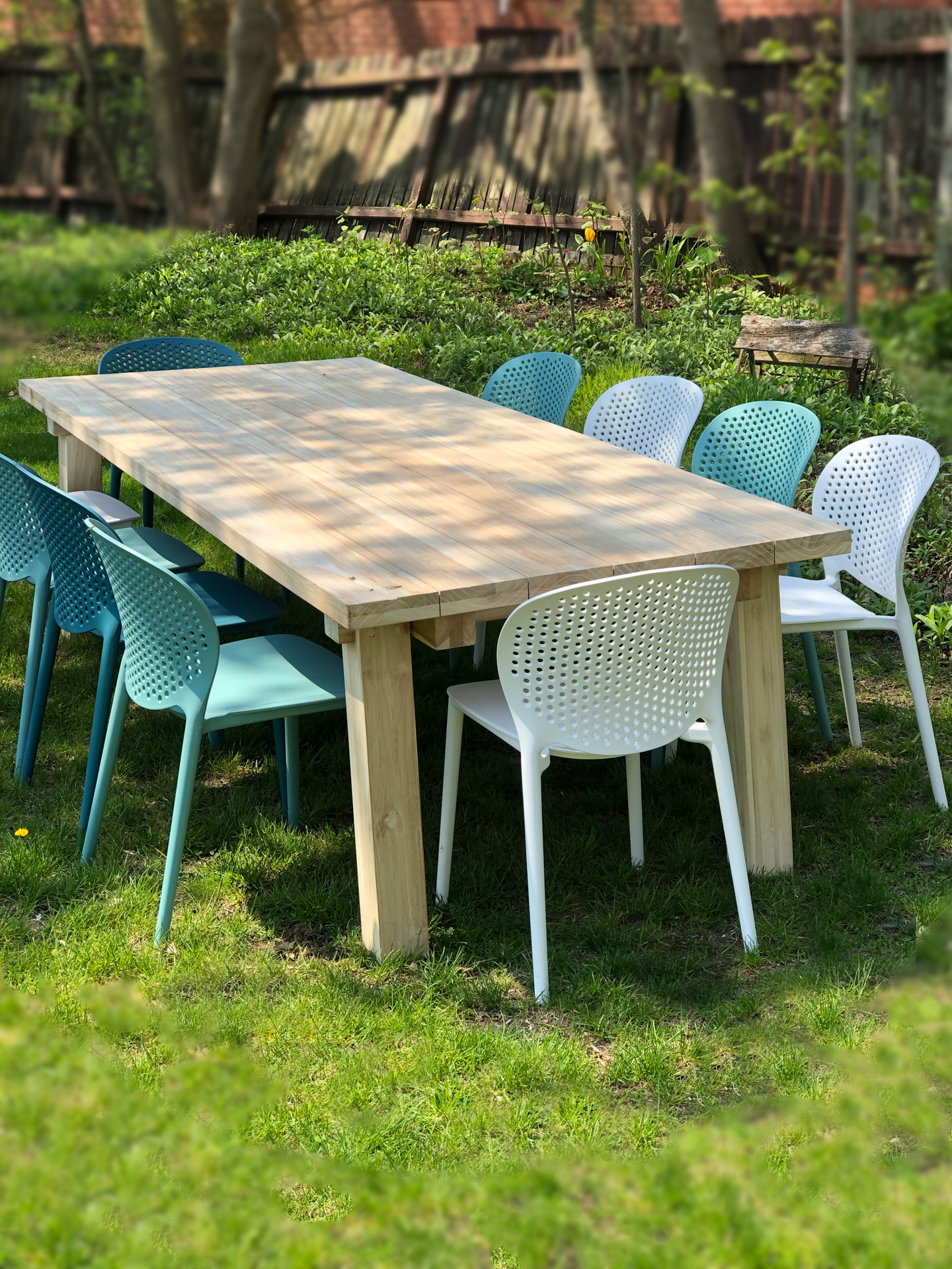 Seasonal al fresco dining at the community table in the backyard at The Ferg vacation rental