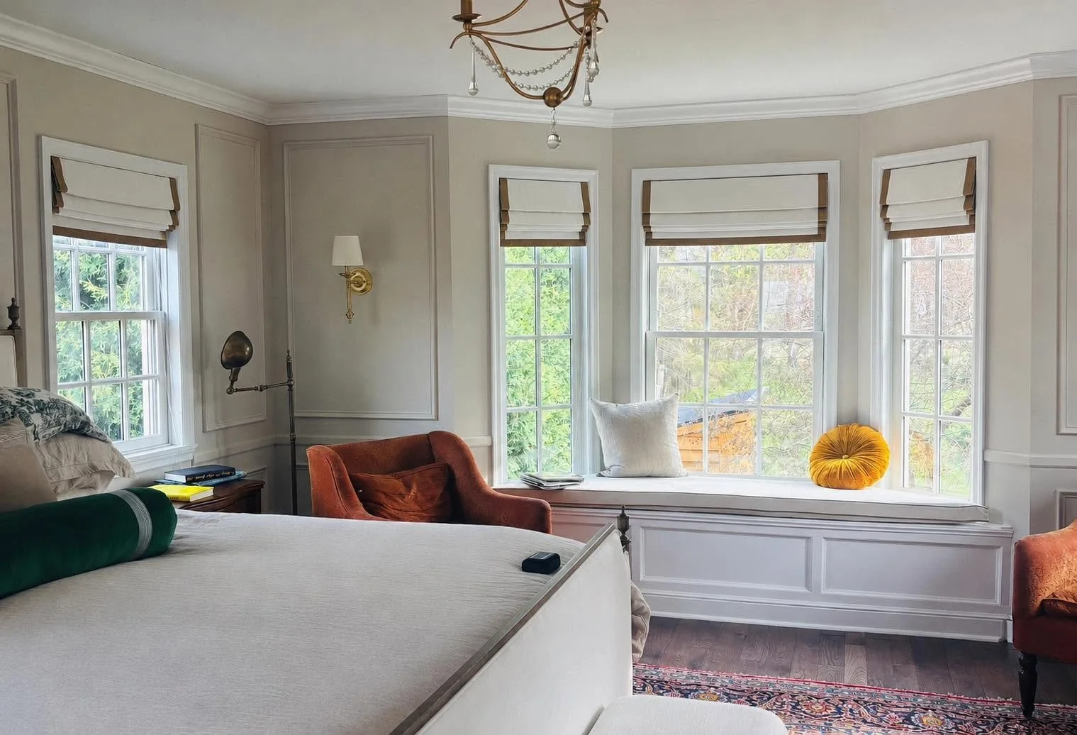 Inside mounted roman shades in a bedroom