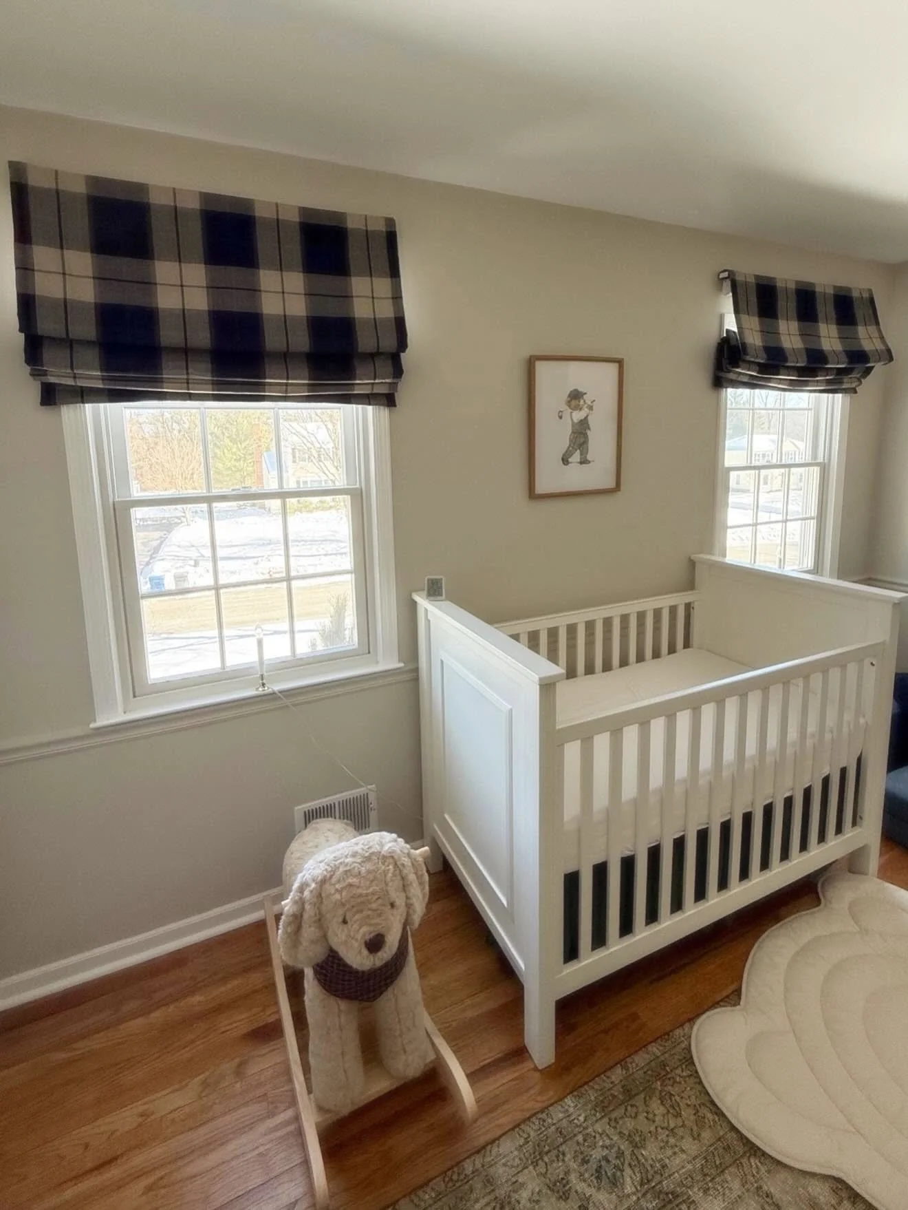 example of an outside mounted cordless roman shade in a nursery