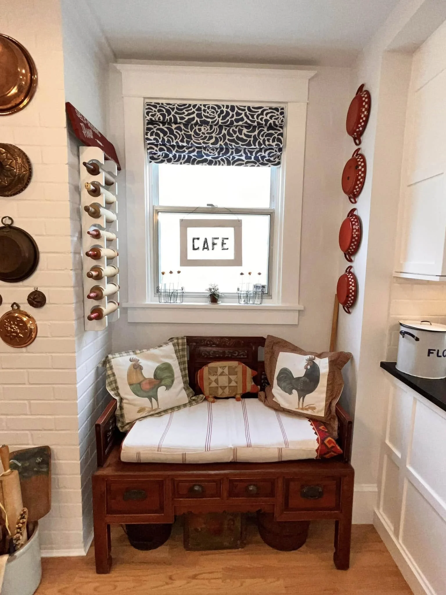 A Country kitchen with our supplied peony fabric used to make the roman shade.